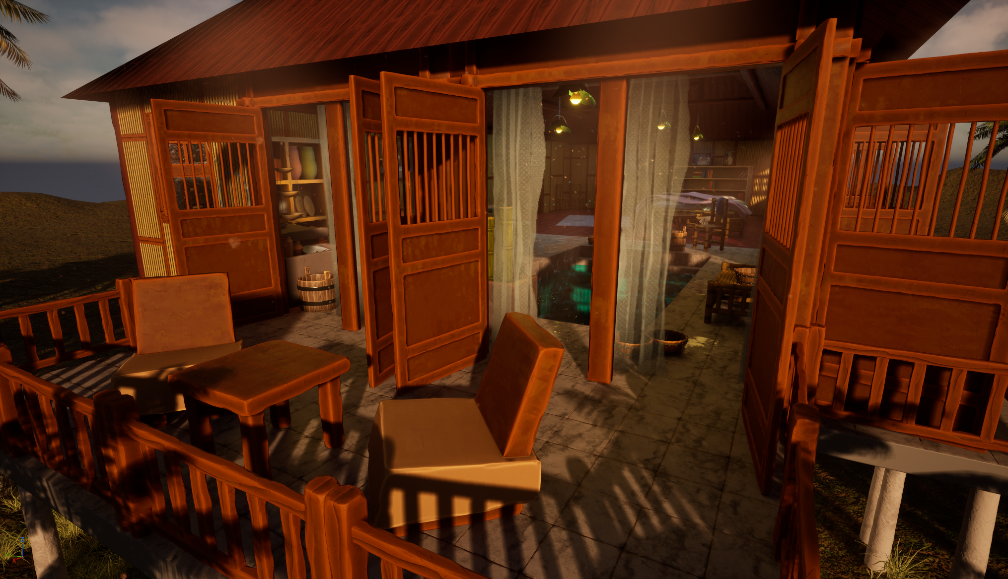 View of a wooden patio with chairs and a railing, attached to a house with open doors revealing a cozy indoor space with books and lighting, at sunset.