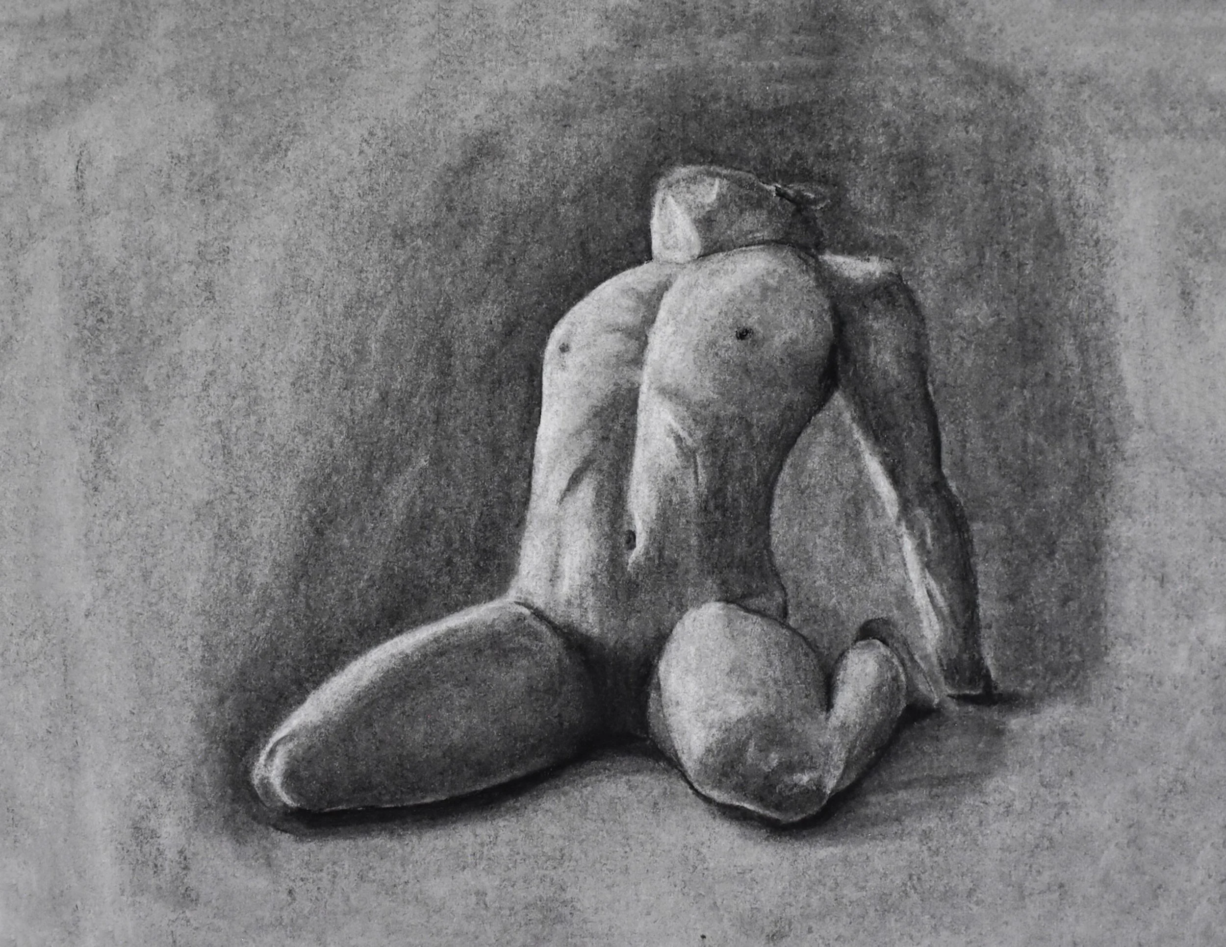 A black and white drawing of a still life featuring several stones or rocks, some rounded and smooth, arranged on a flat surface.