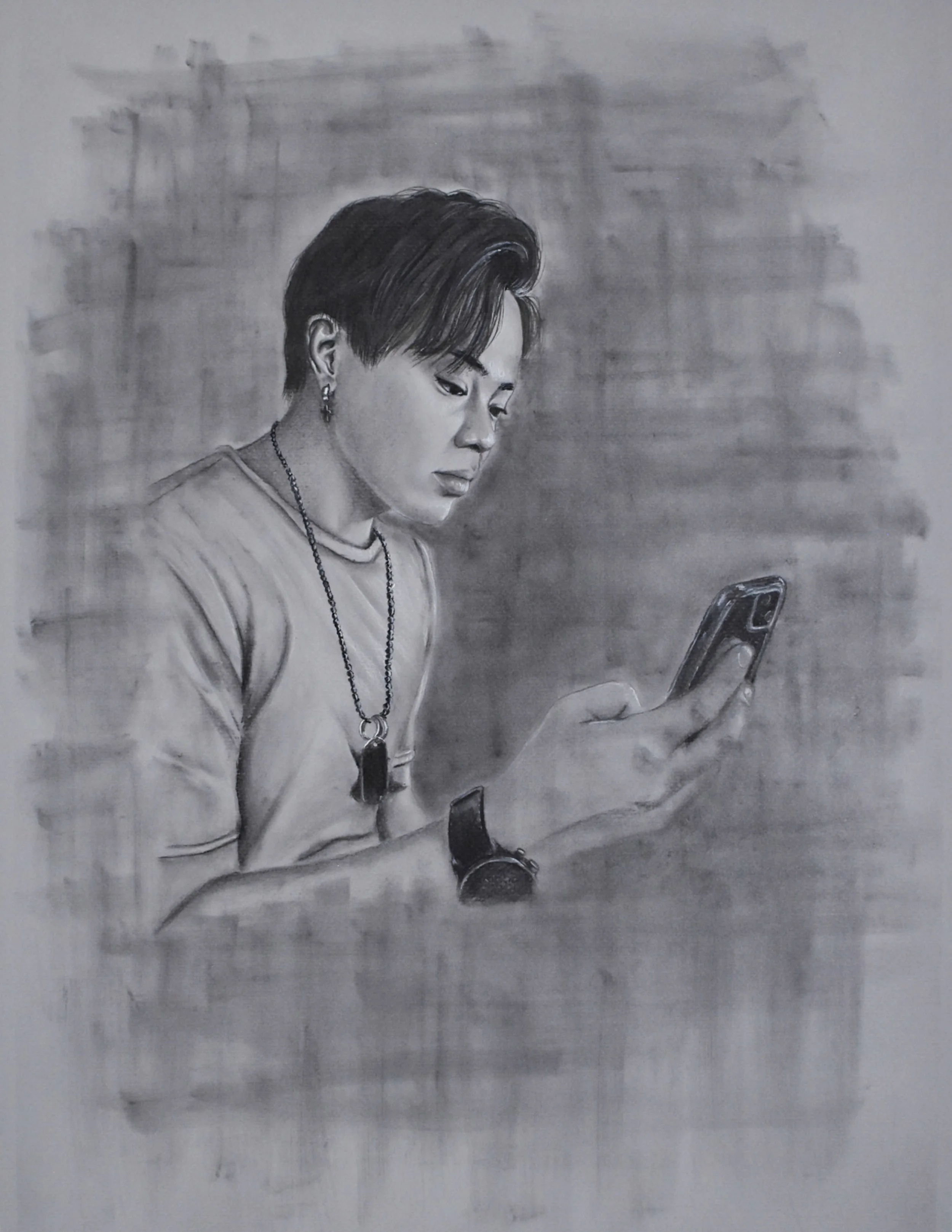 Black and white drawing of a young man with earrings and a necklace, looking at his phone. He is wearing a T-shirt and a watch.