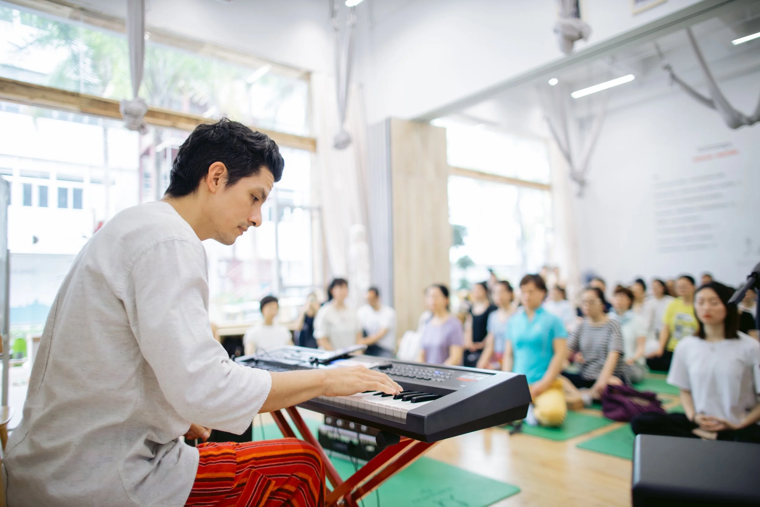 Angelo Cast performing live music meditation in China