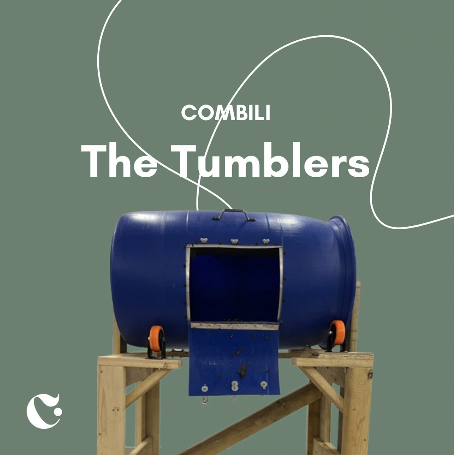 A Blue TumbleTrak roller mounted on a wooden stand with orange wheels, positioned against a green background with white text and lines that read "COMBILI The Tumblers."