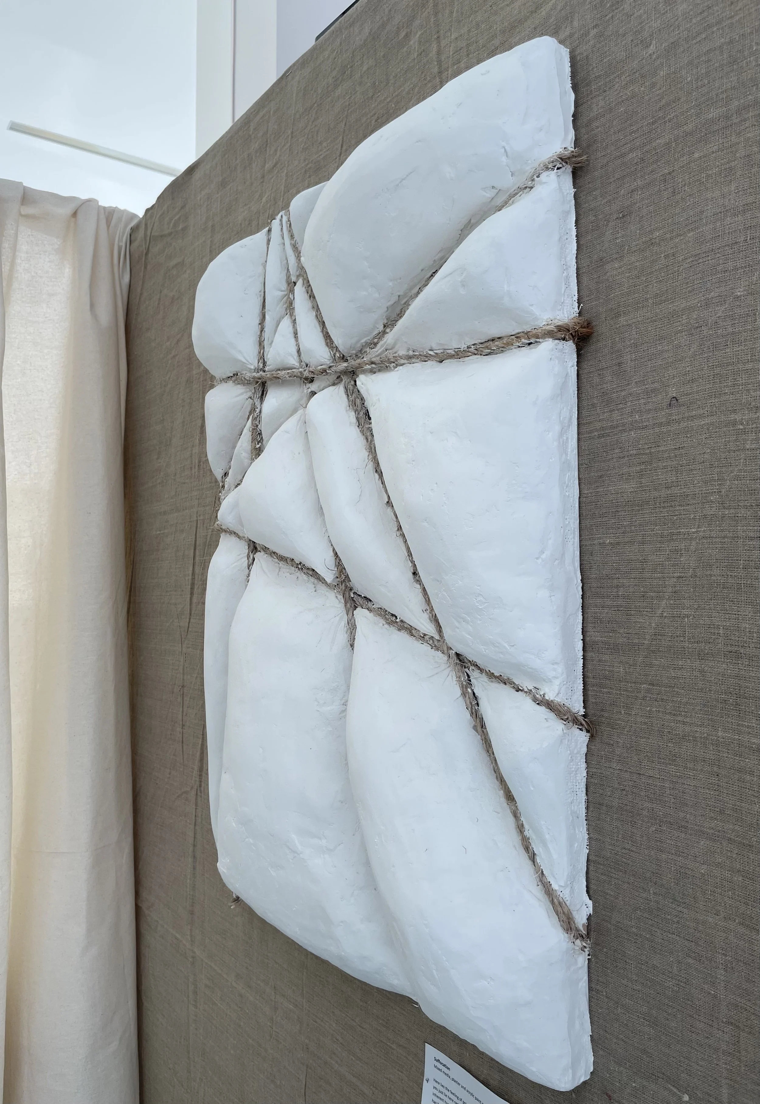 Suffocation (2024), Mixed media, plaster and acrylic paint on wood | 52cm x 70cm