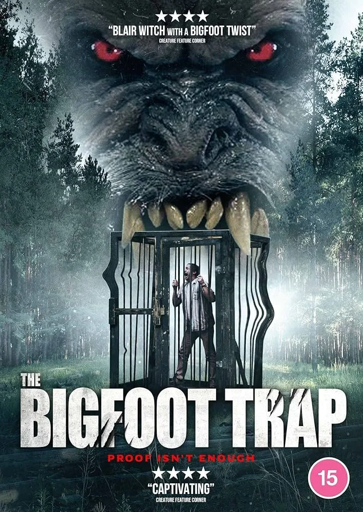 A movie poster depicting a giant beast with red eyes and sharp teeth looming over a person trapped inside a cage. The title reads "The Bigfoot Trap" with the tagline "Proof isn't enough." The background features a misty forest scene.