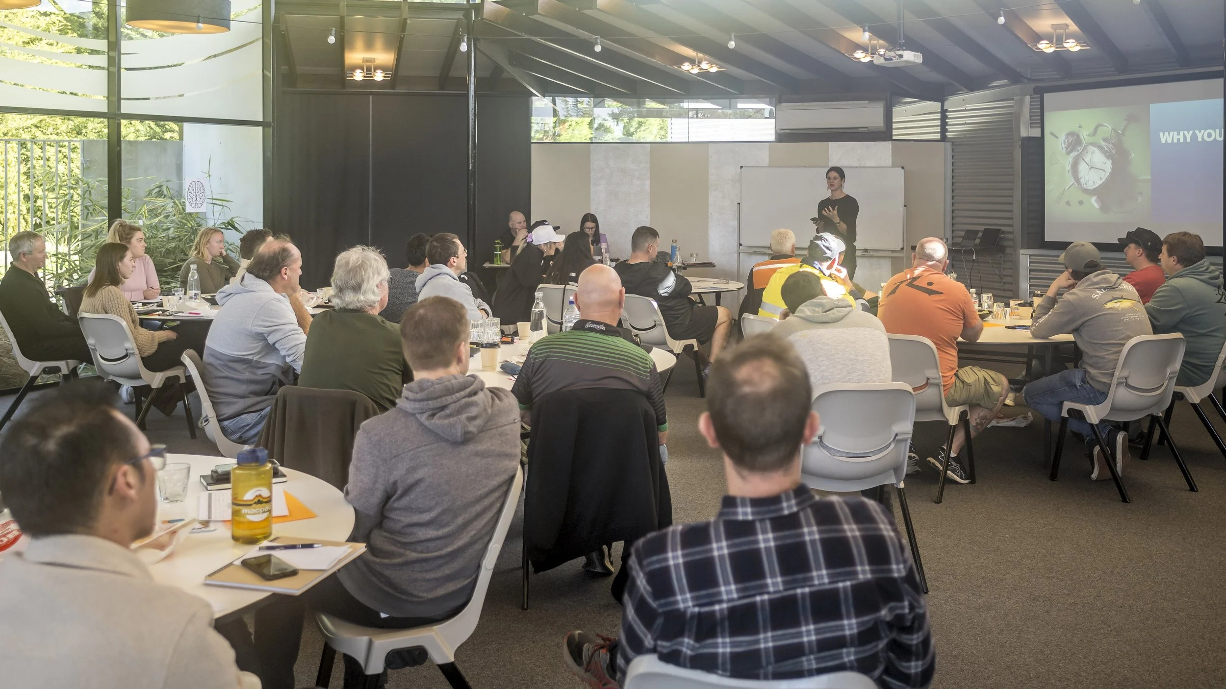 Penny Terry leading a communication workshop of 50 people. 