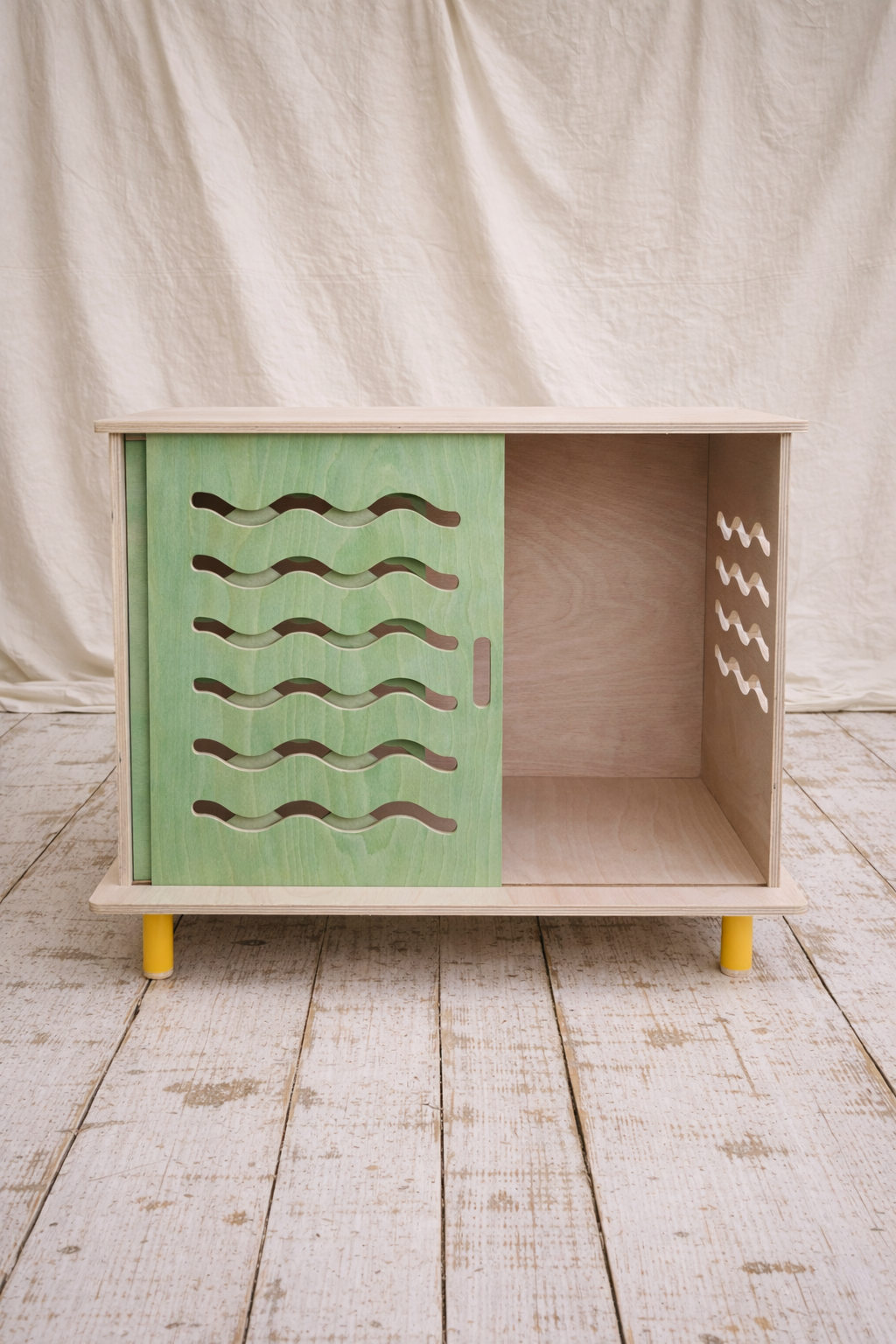 Designer dog crate made from responsibly sourced materials in a modern neutral finish