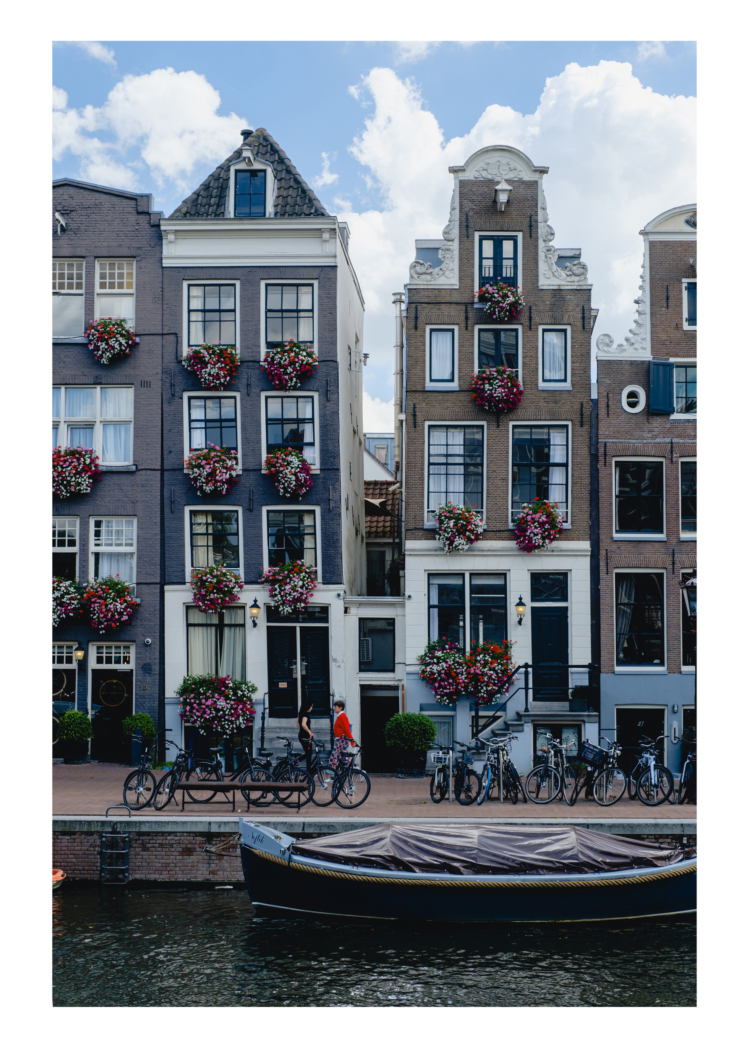 Amsterdam canal houses with cascading flower boxes on every window