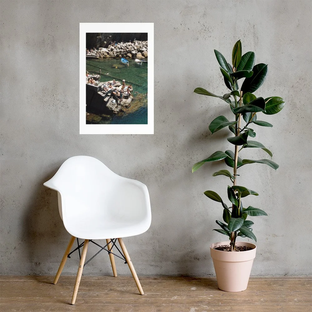 Cinque Terre coastal wall art print capturing swimmers, boats, and emerald Mediterranean water. Italian summer photography full of warmth and texture.