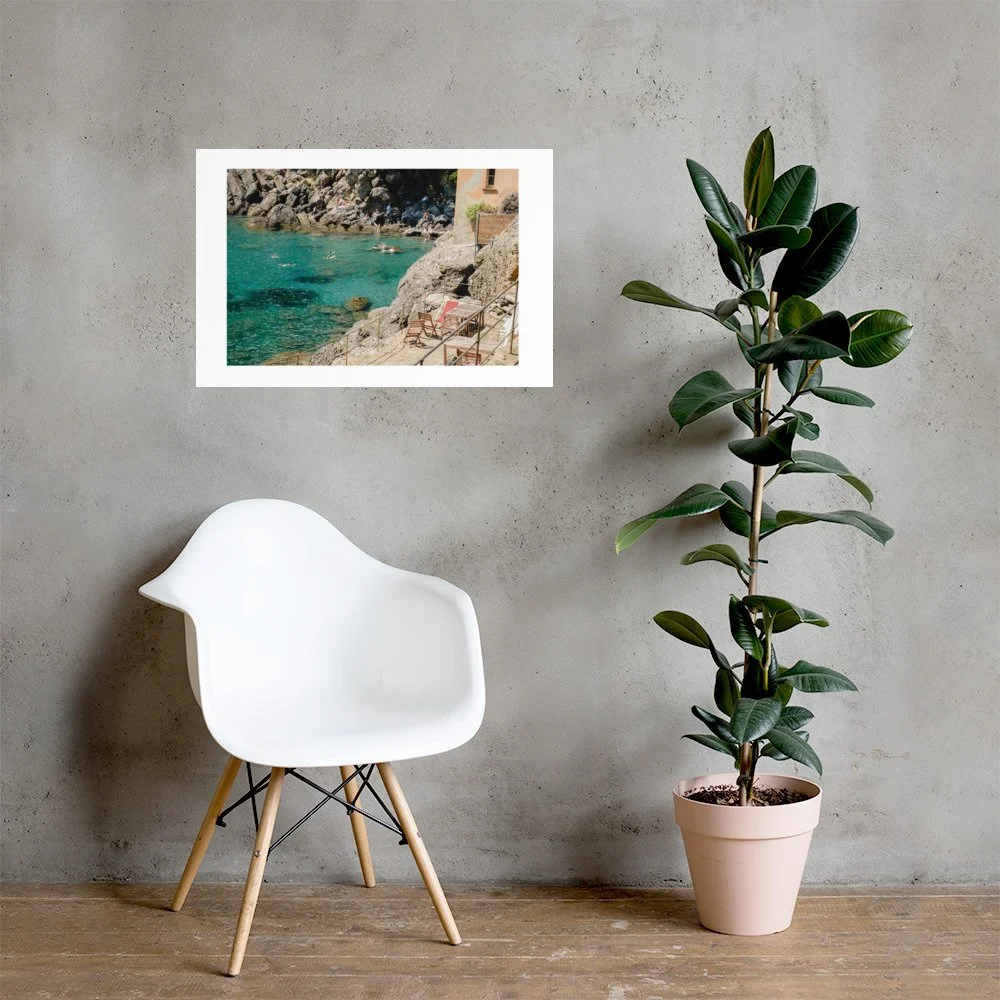 Italian coastal wall art featuring a hidden Mediterranean cove with turquoise water and warm stone textures. Relaxed European summer photography.