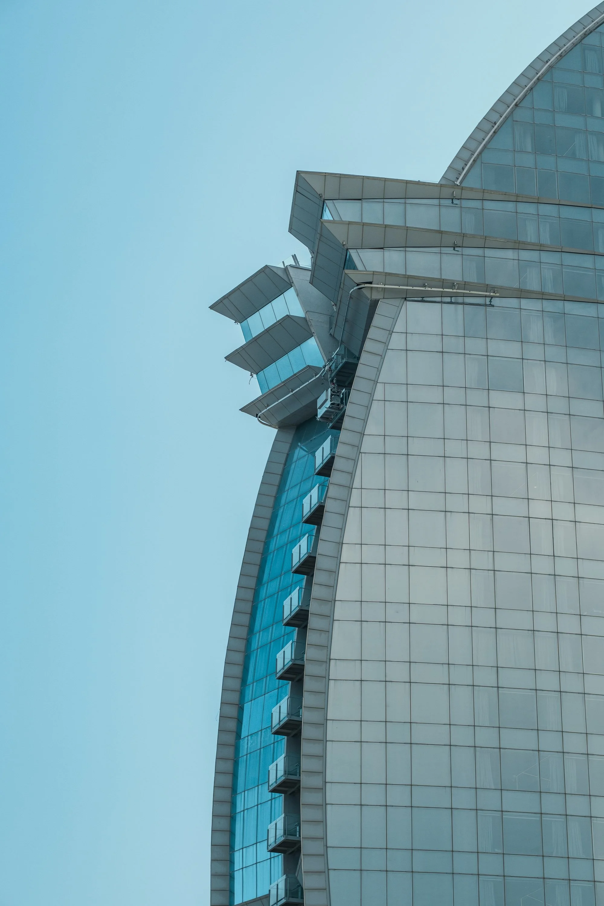 Minimal architectural photograph of Barcelona’s W Hotel. A modern Mediterranean fine art print with clean lines and serene blue tones.