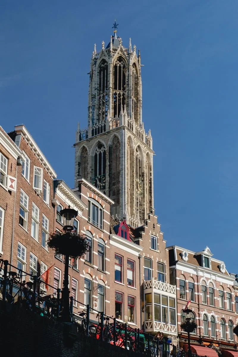 Utrecht's Dom Tower rises over the city's brick facades