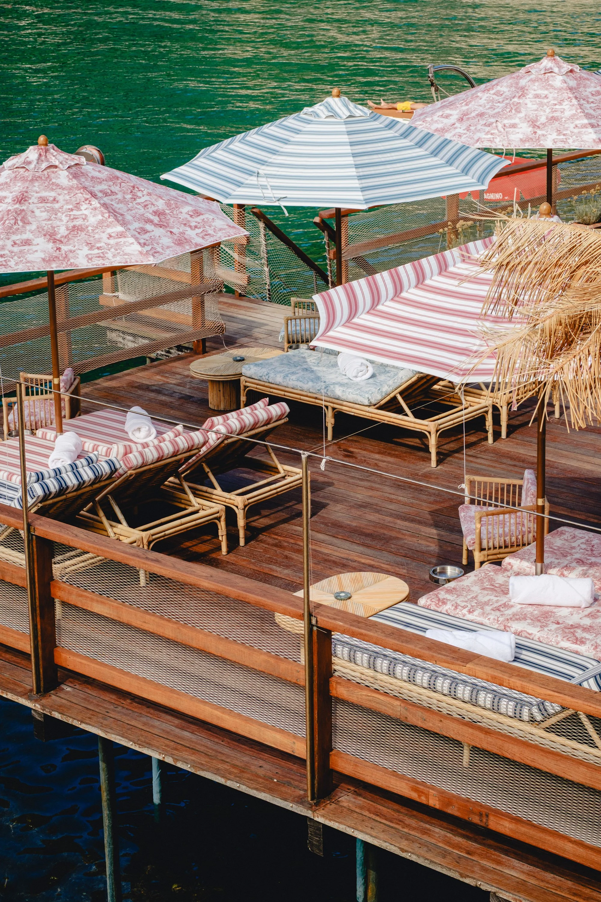 Mediterranean beach club photography with striped parasols and turquoise water. A warm Italian summer fine art print.