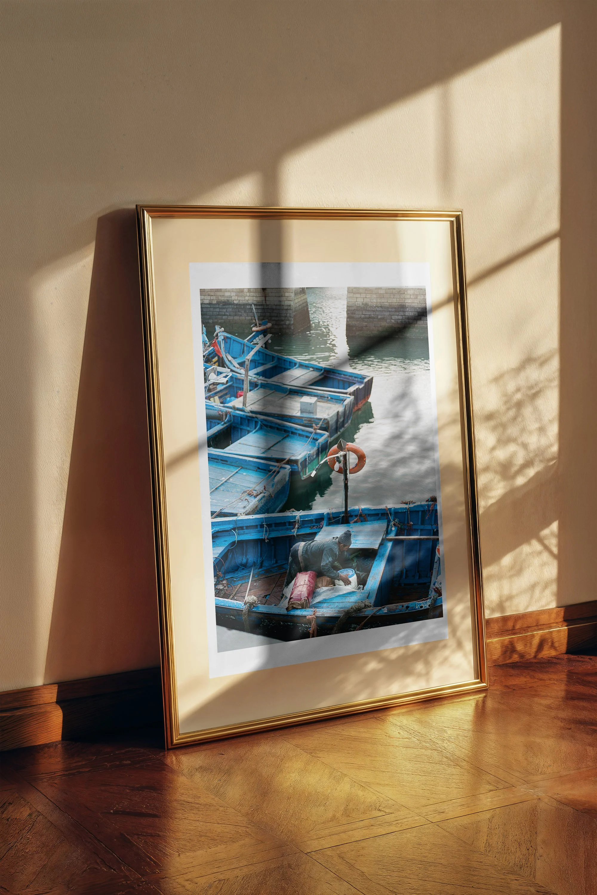 Blue Boats fine art print framed and displayed on a wall - fine art travel photography by Frames by Marina