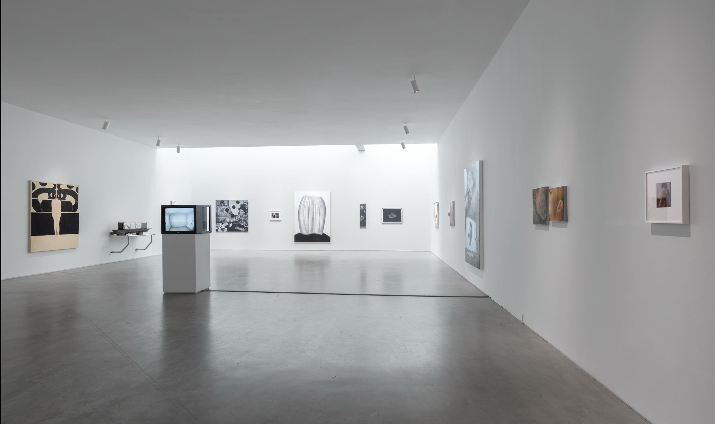 An image featuring an exhibition of oil paintings and video art at Gladstone gallery. 