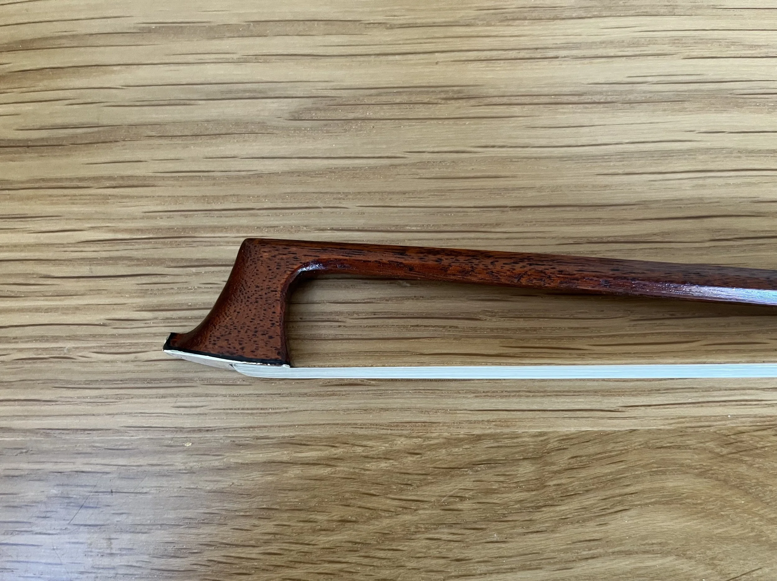 Commissioned Bow repair and restoration on workbench. Instrument repairs