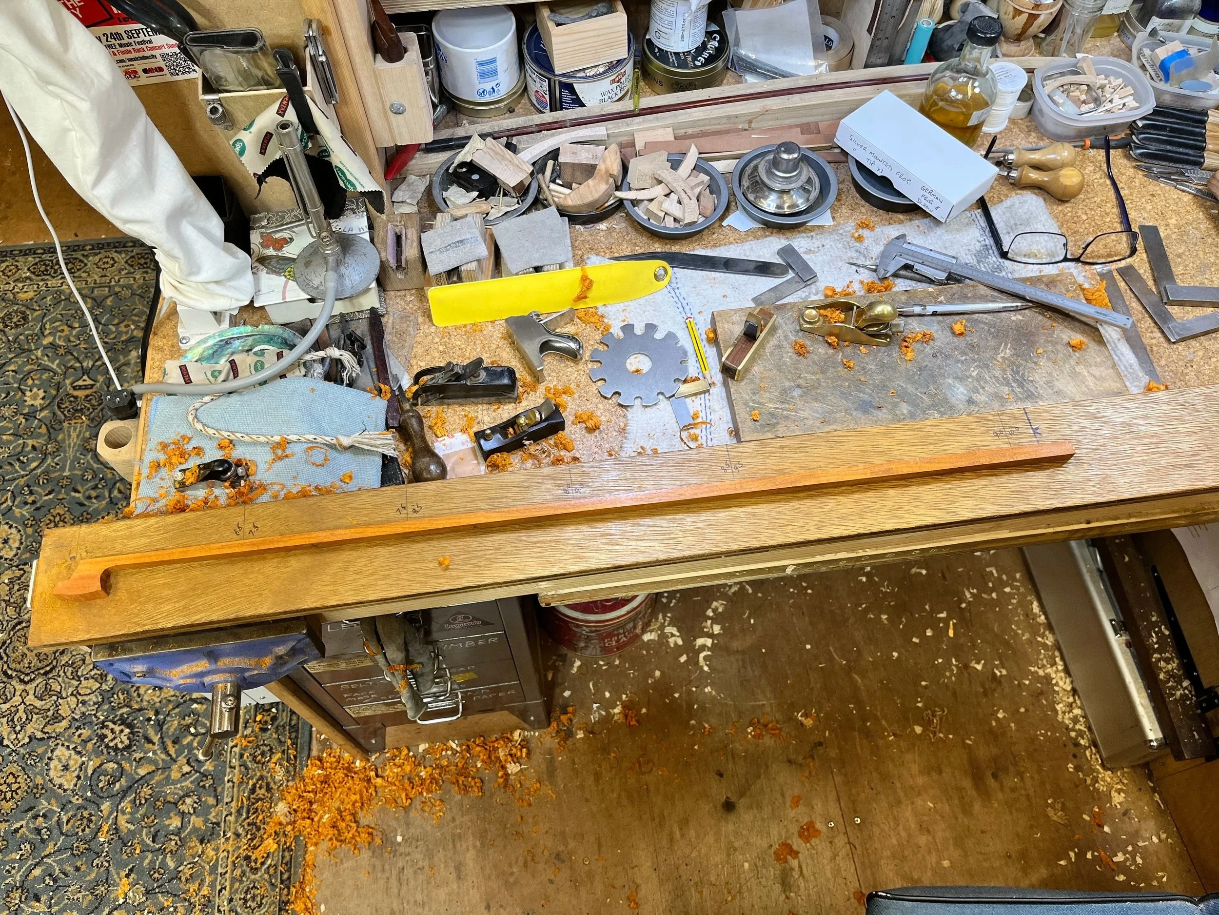 Commissioned Bow repair and restoration on workbench. Instrument repairs.