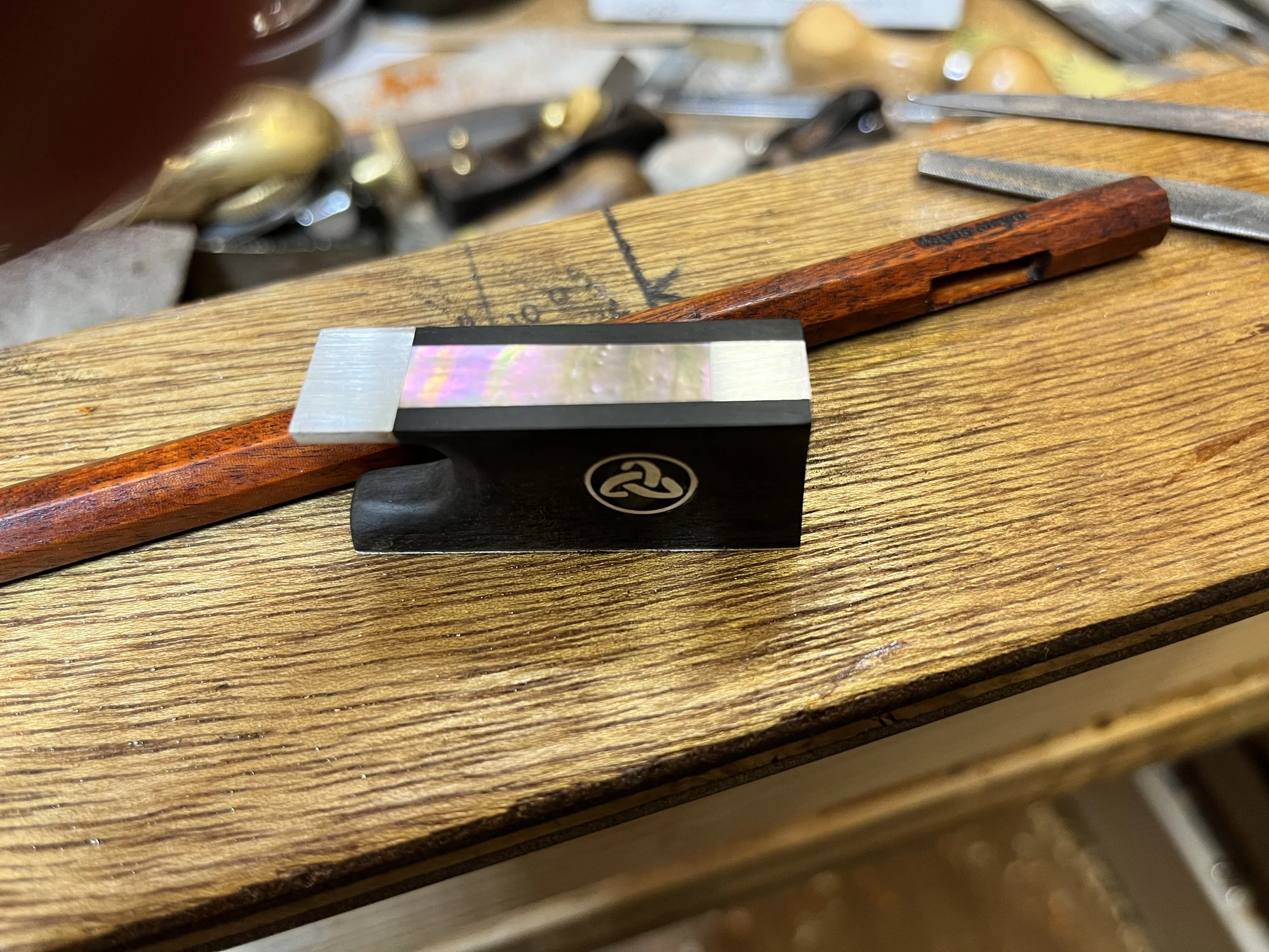 Commissioned Bow repair and restoration on workbench. Instrument repairs