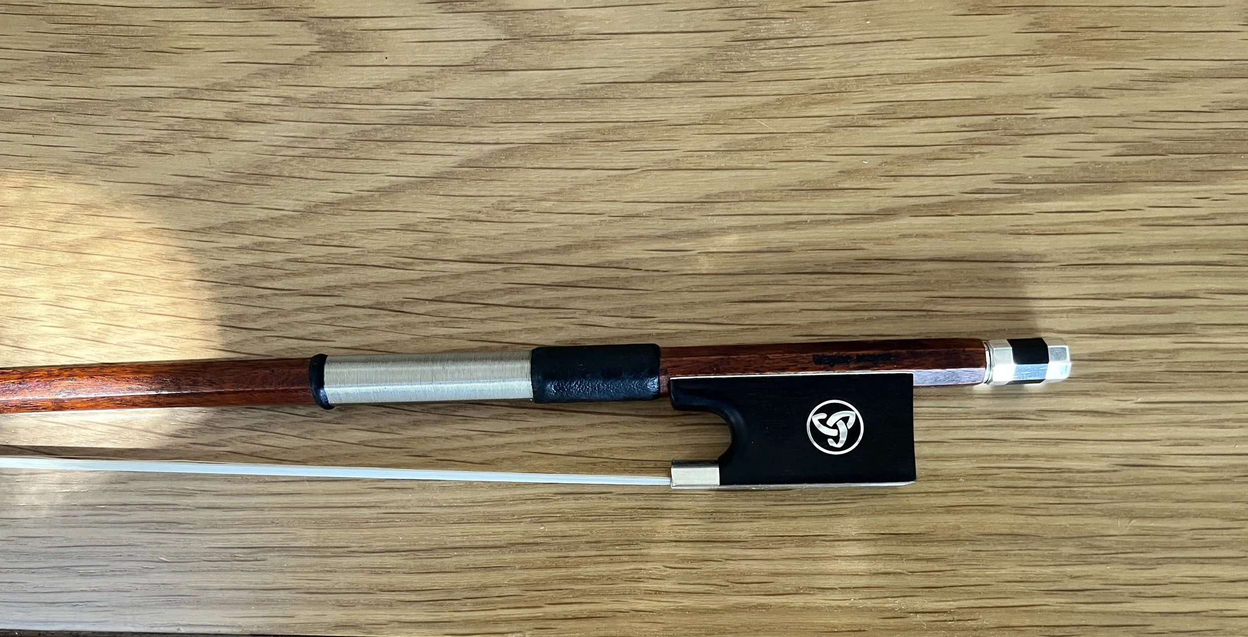 Commissioned Bow repair and restoration on workbench. Instrument repairs