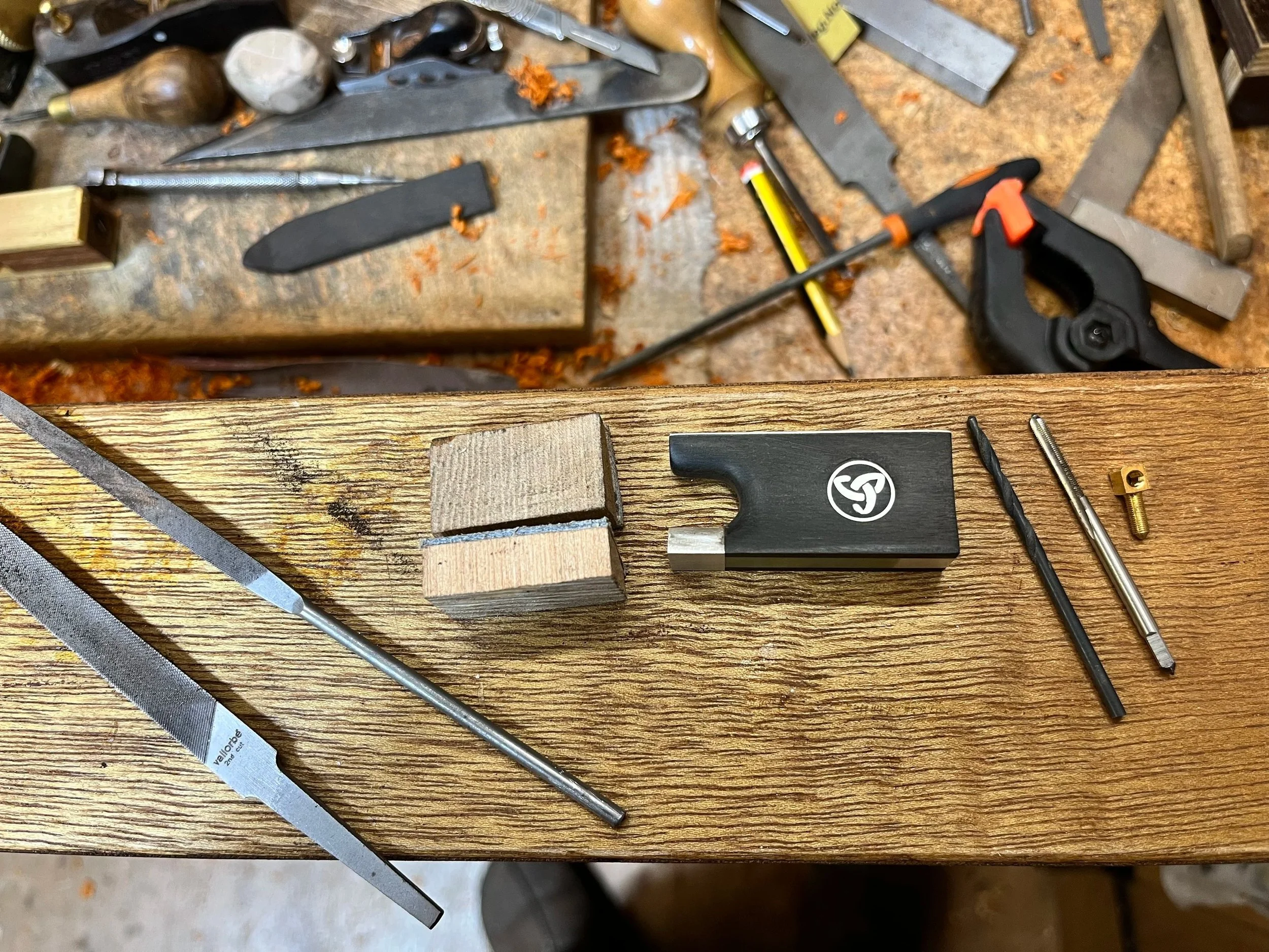 Commissioned Bow repair and restoration on workbench. Instrument repairs