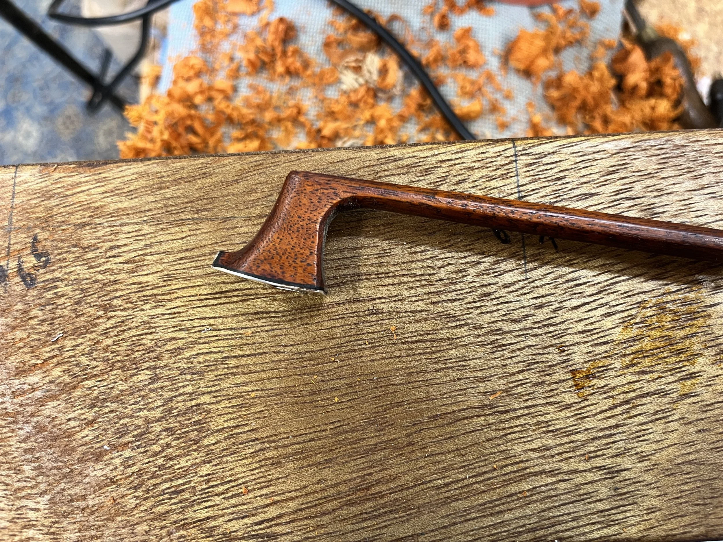 Commissioned Bow repair and restoration on workbench. Instrument repairs