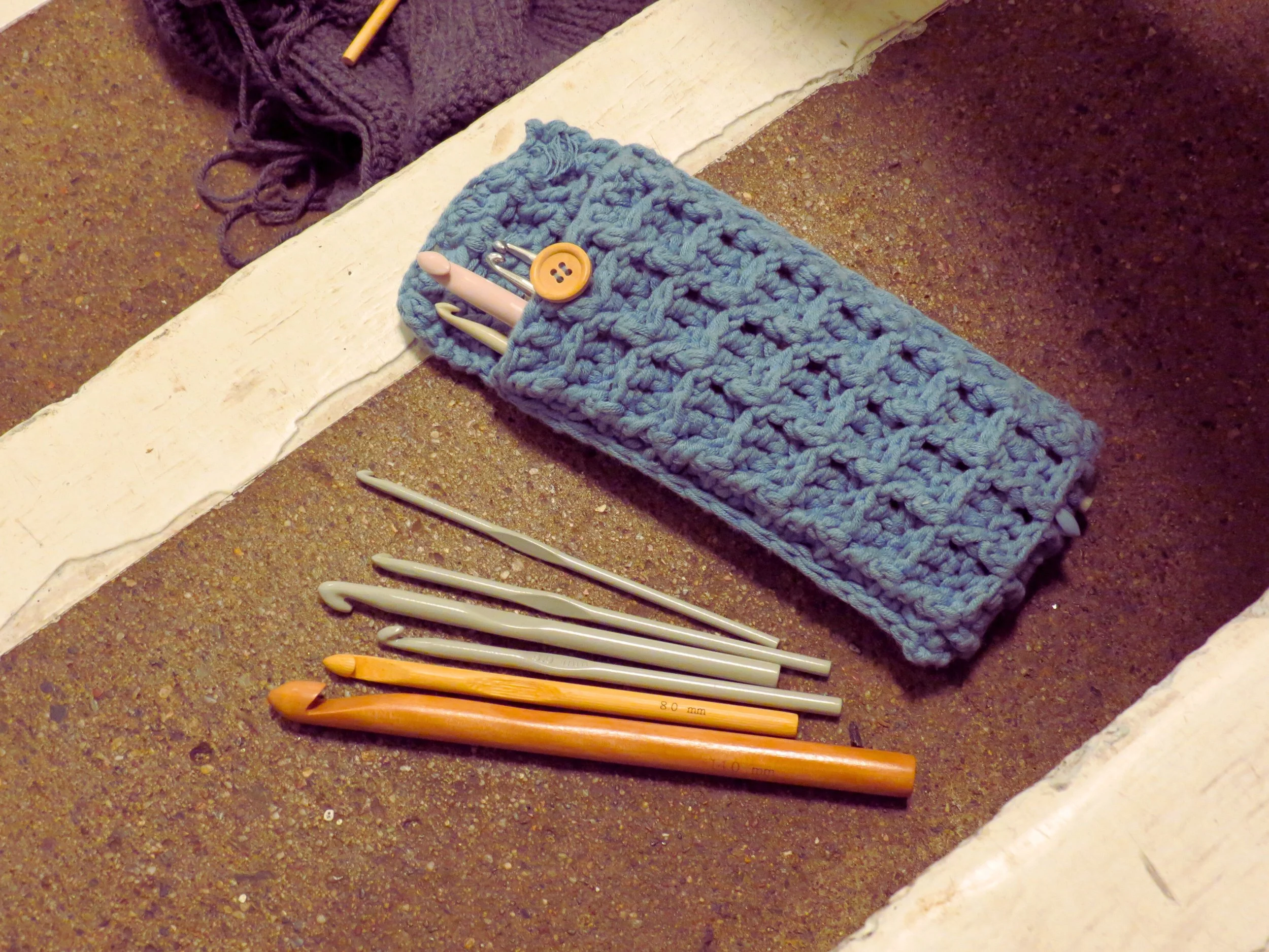 Sarah Edoghogho her crochet needles in her selfmade pouch