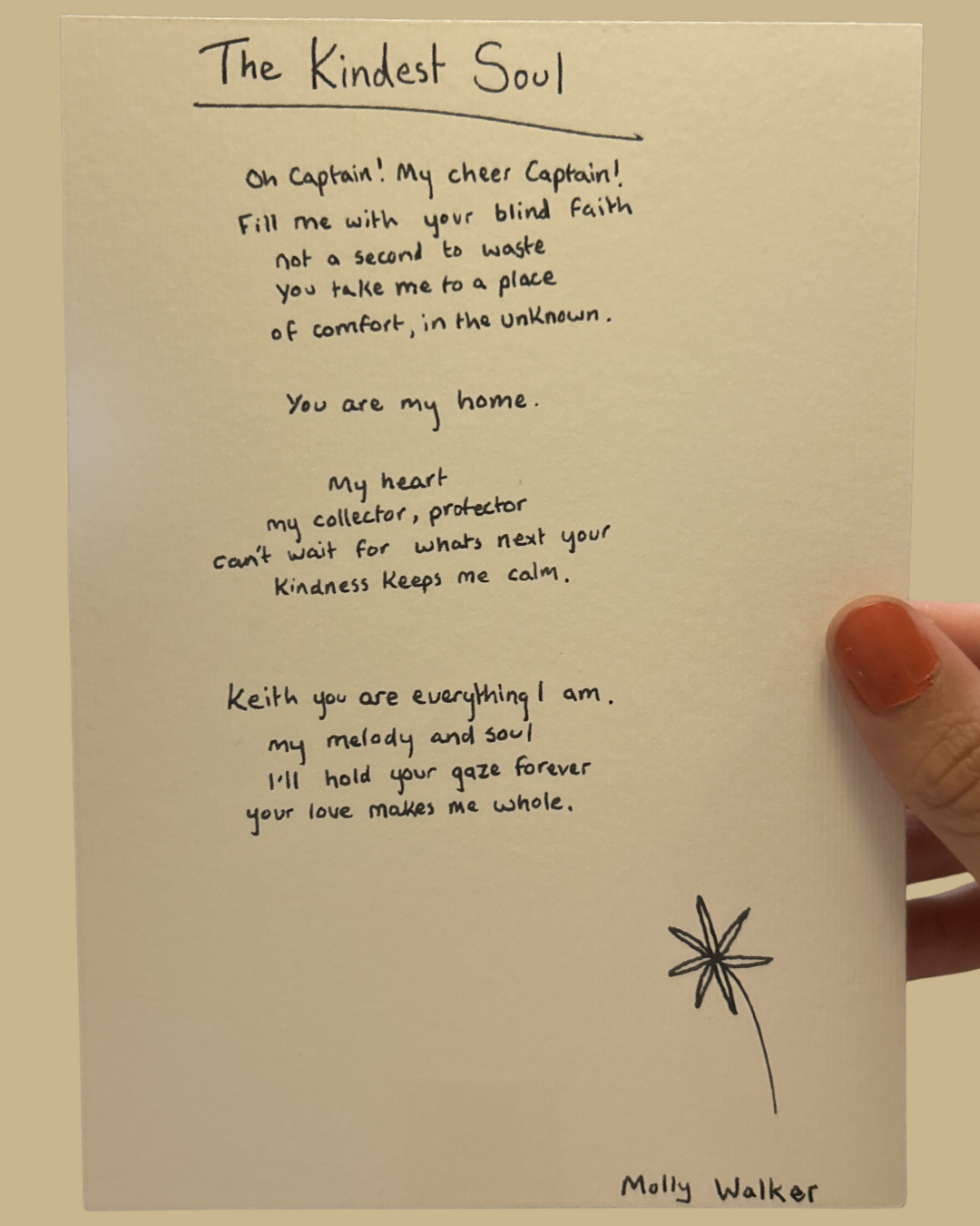 A handwritten poem titled 'The Kindest Soul' on a piece of paper with a small, simple flower drawing at the bottom right corner. The poem expresses love and admiration. The poem is signed by Molly Walker.