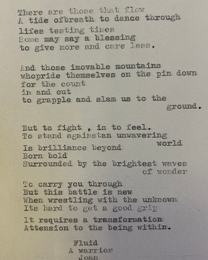 A typed poem discussing mountains, fighting, and transformation, ending with the words 'Fluid, A warrior'.