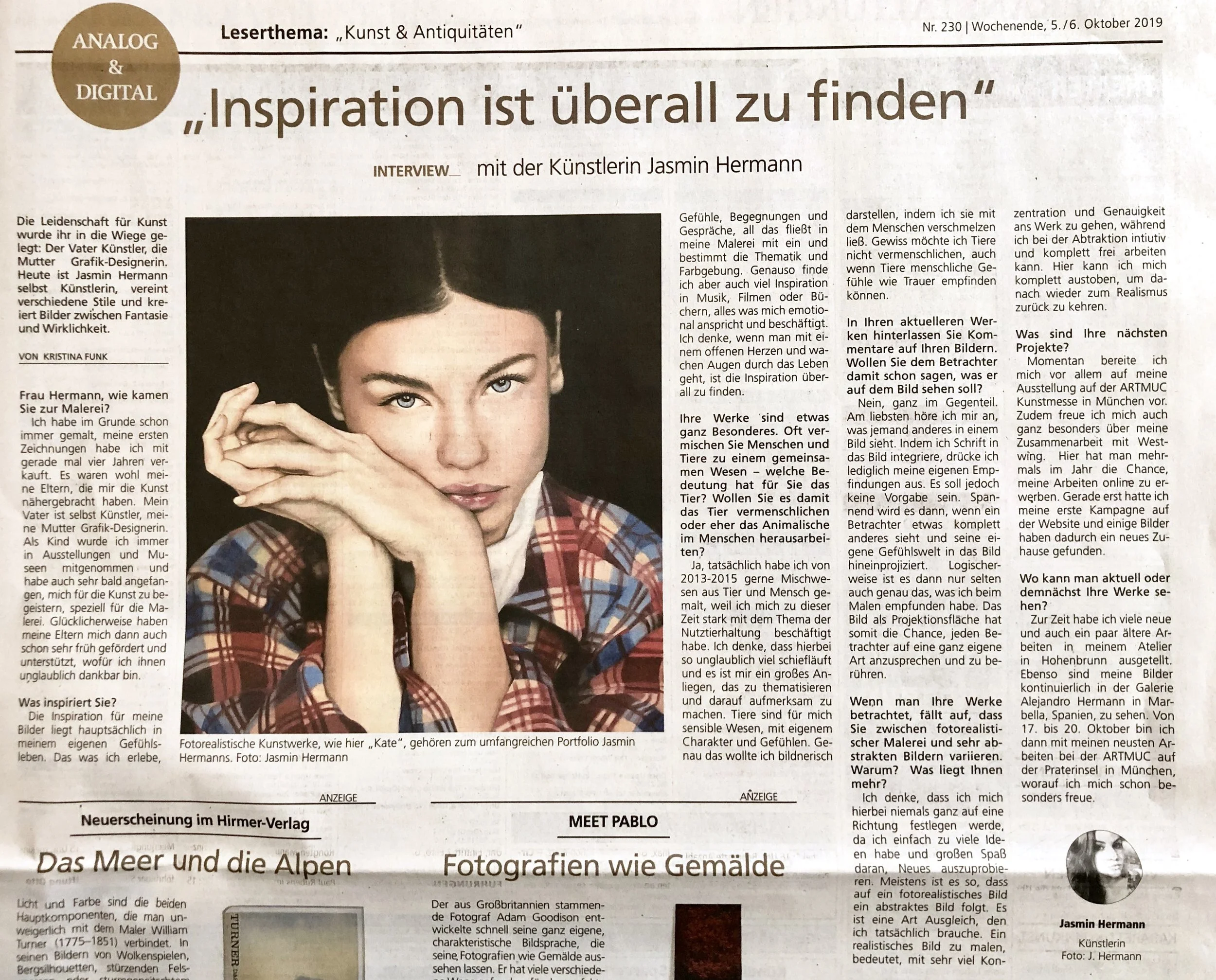 A woman with dark hair and fair skin, wearing a colorful plaid jacket, posing with her hand near her face in a newspaper article about her artistic work. The article includes German text and her name is Jasmin Hermann.