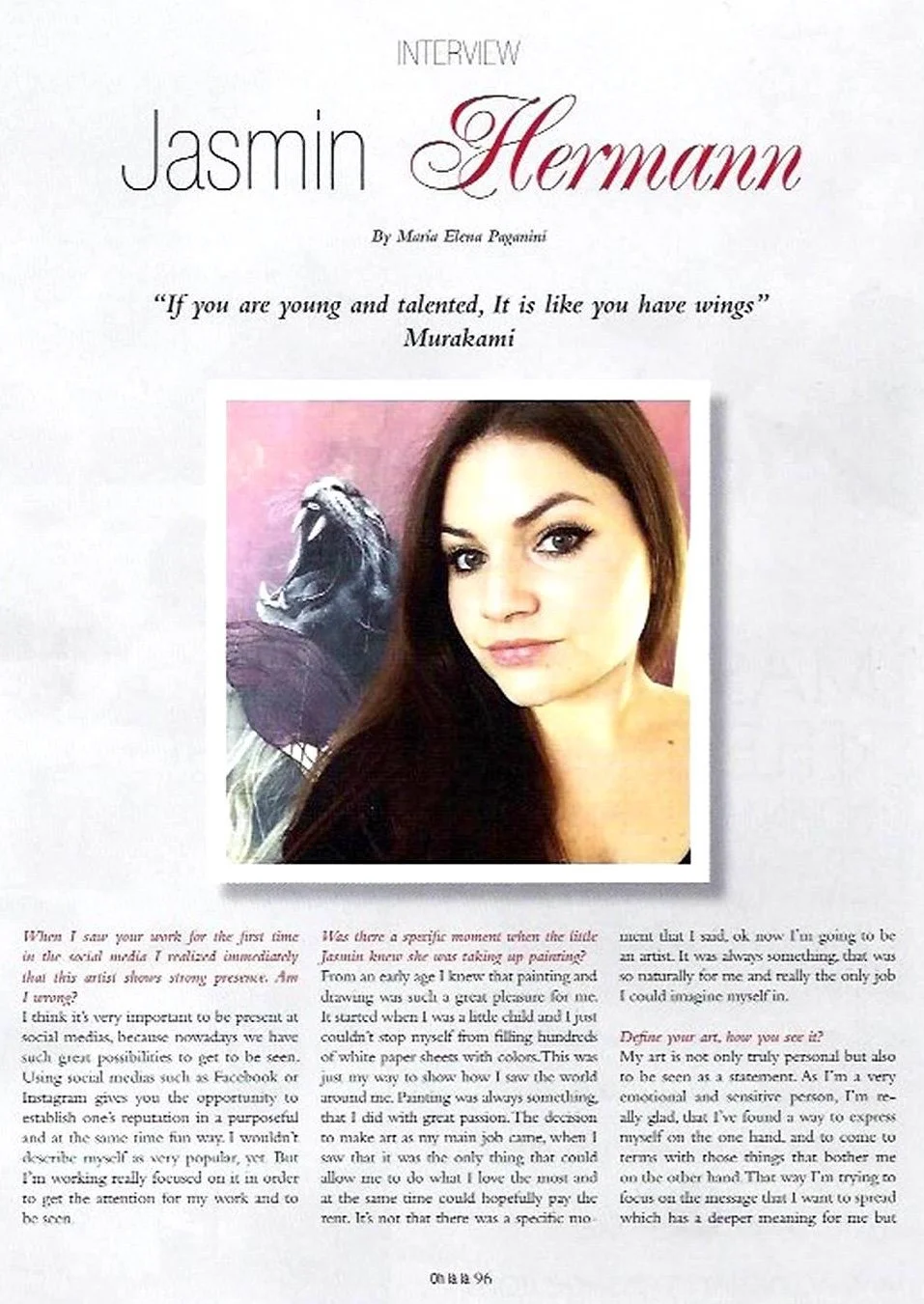 An interview article featuring Jasmin Hermann, with a quote from Murakami. It includes a portrait of Jasmin Hermann with long brown hair and makeup, and a background image of a roaring lion.
