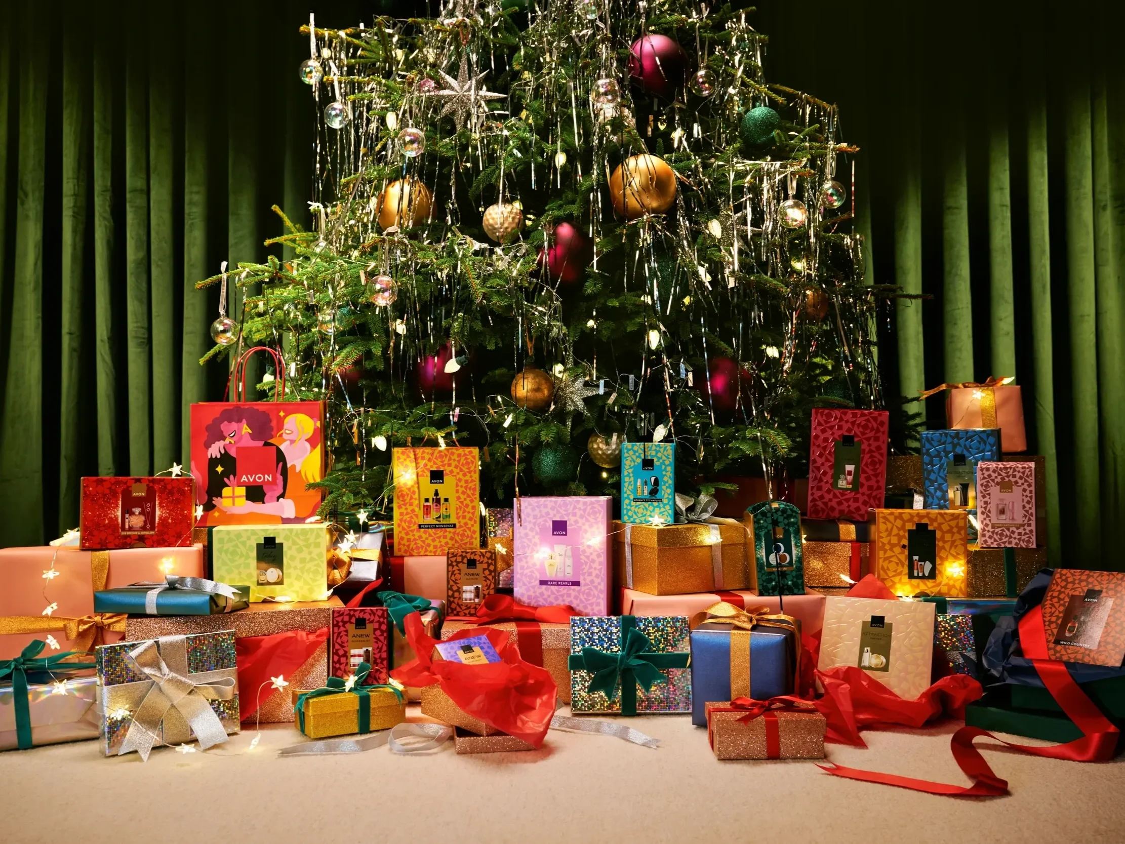 Christmas tree decorated with ornaments and tinsel, surrounded by wrapped presents with ribbons and bows.