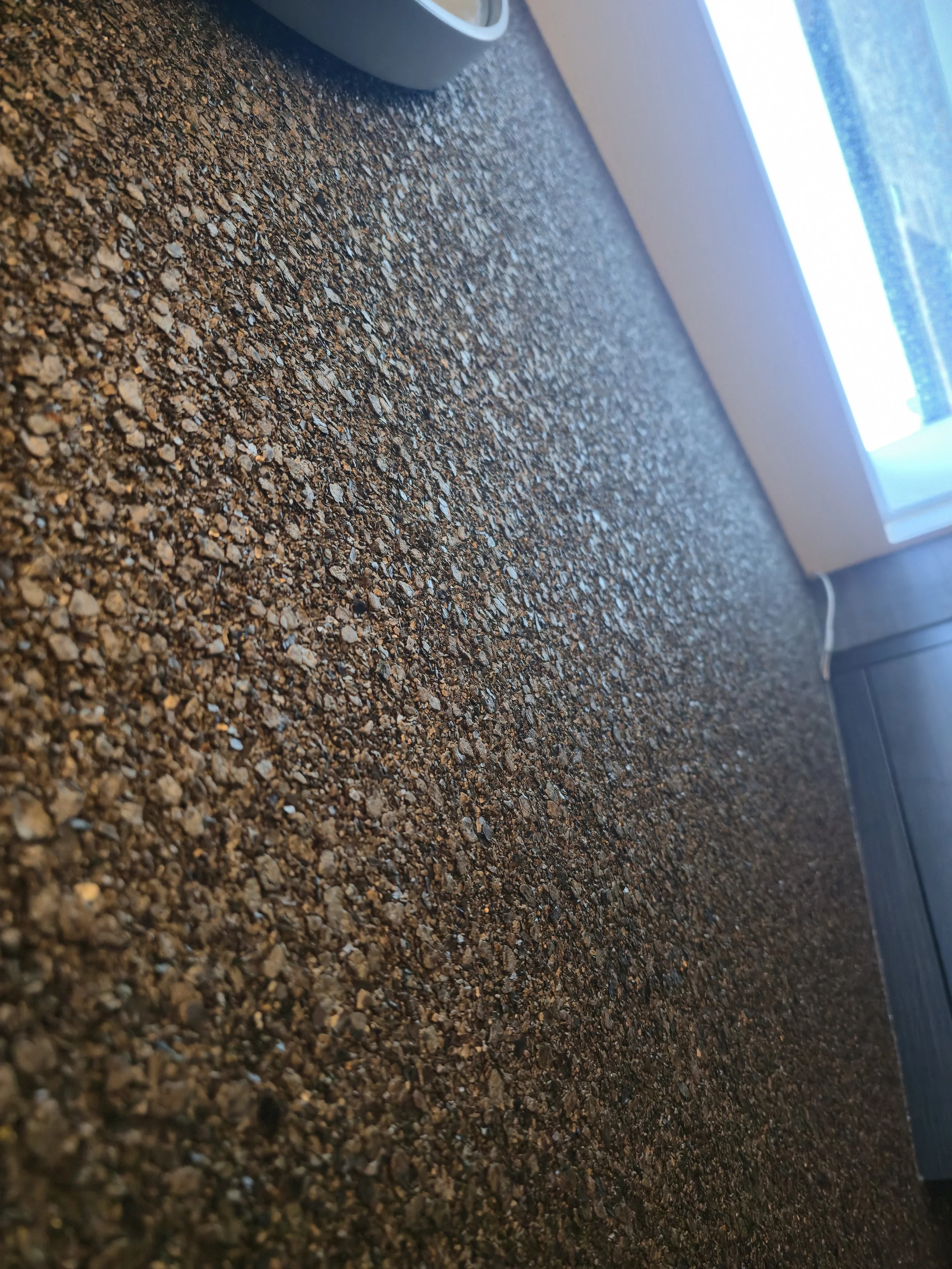 Specialist installation of heavy-textured mineral and glass-bead wallcoverings by professional paperhanger.
