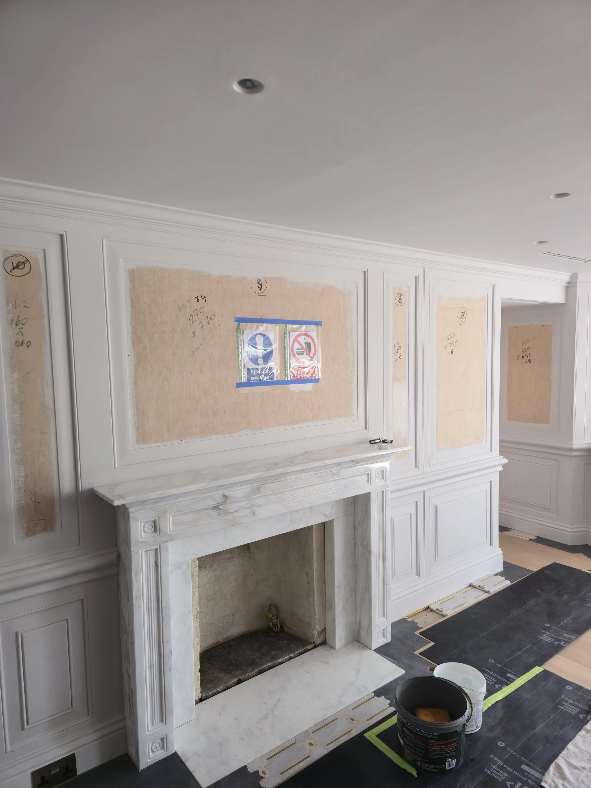 Meticulous surface preparation and priming to ensure a perfectly smooth foundation for delicate silk wallcoverings.