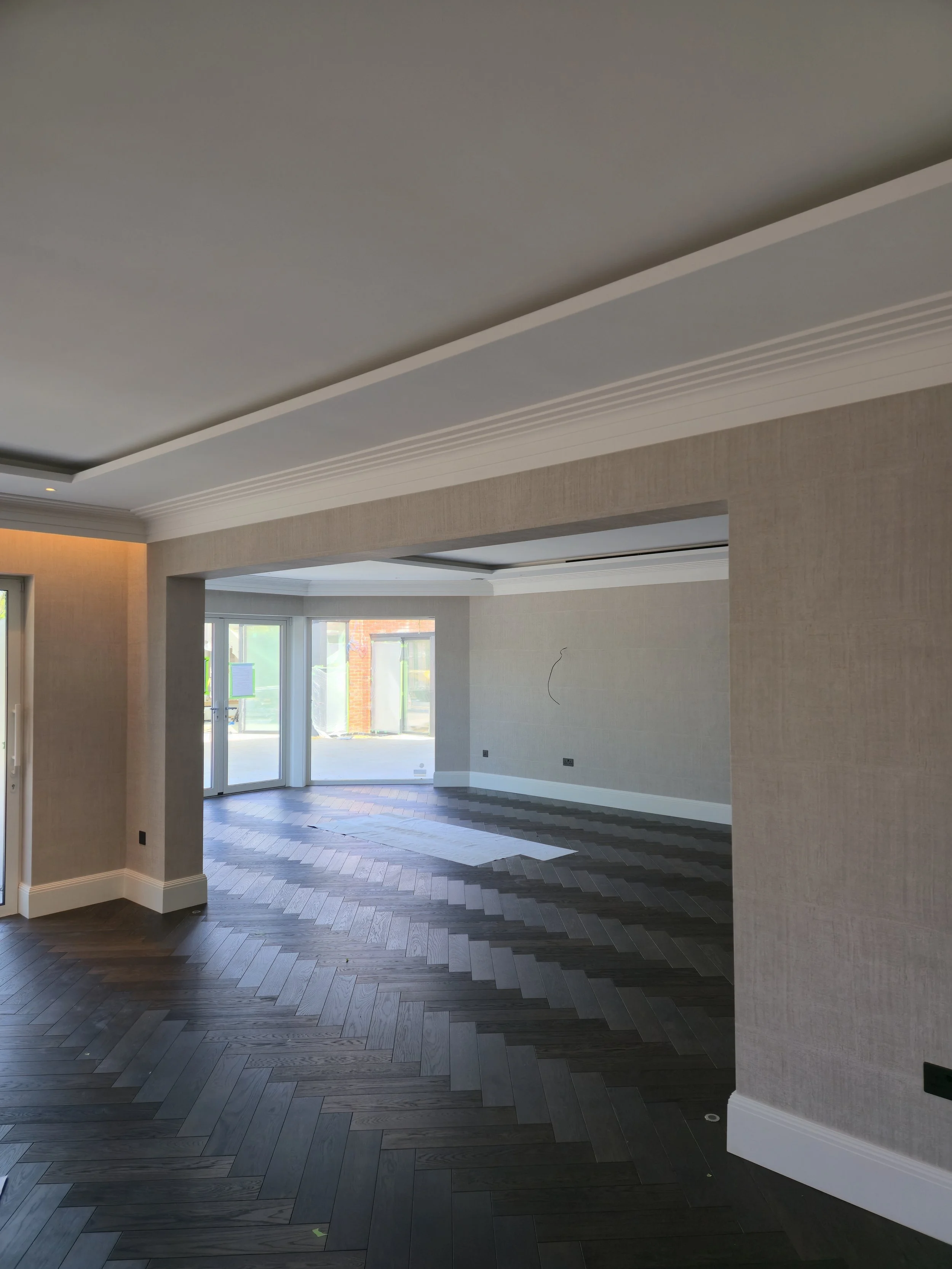 Seamless installation of Arte wallcoverings across expansive open-plan spaces, ensuring perfect visual continuity and alignment.