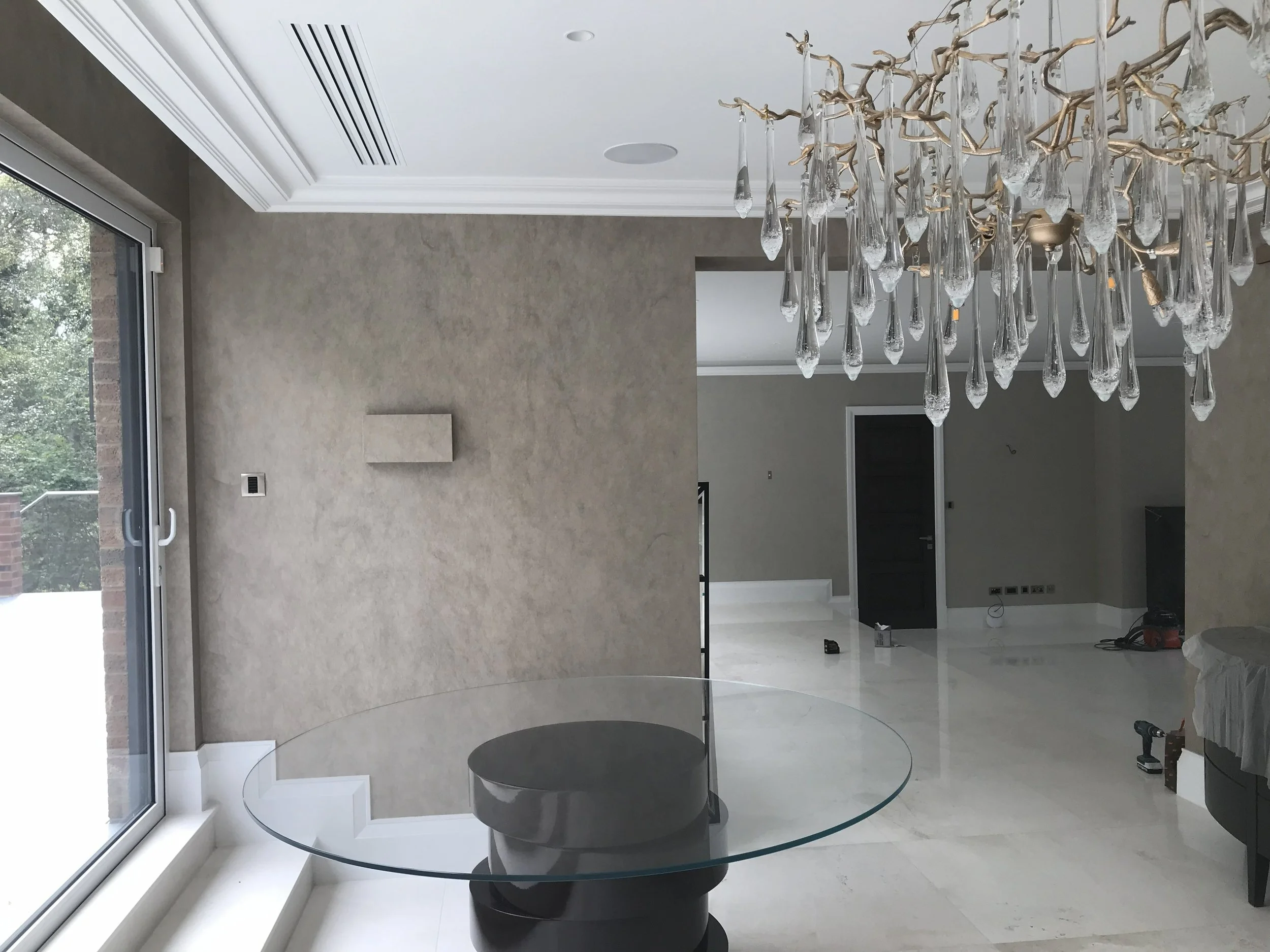 Professional installation of Tektura wide-width fabric-backed wallcovering. High-end hallway decoration with seamless finish in London.