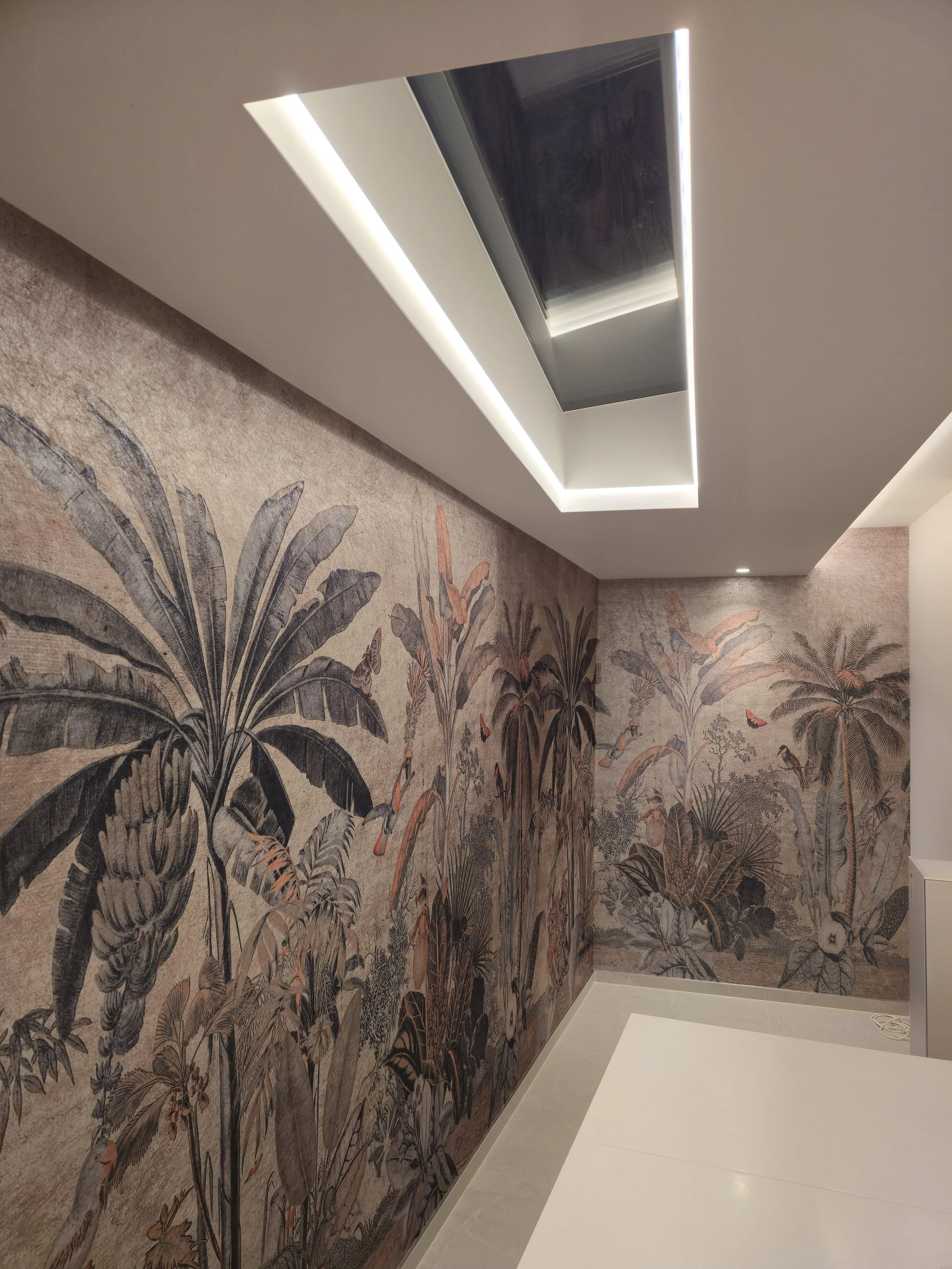 Expert installation of Arte Flamant Les Mémoires 'Milk and Honey' wallpaper. Seamless pattern matching around skylight and corners in a luxury London residence.