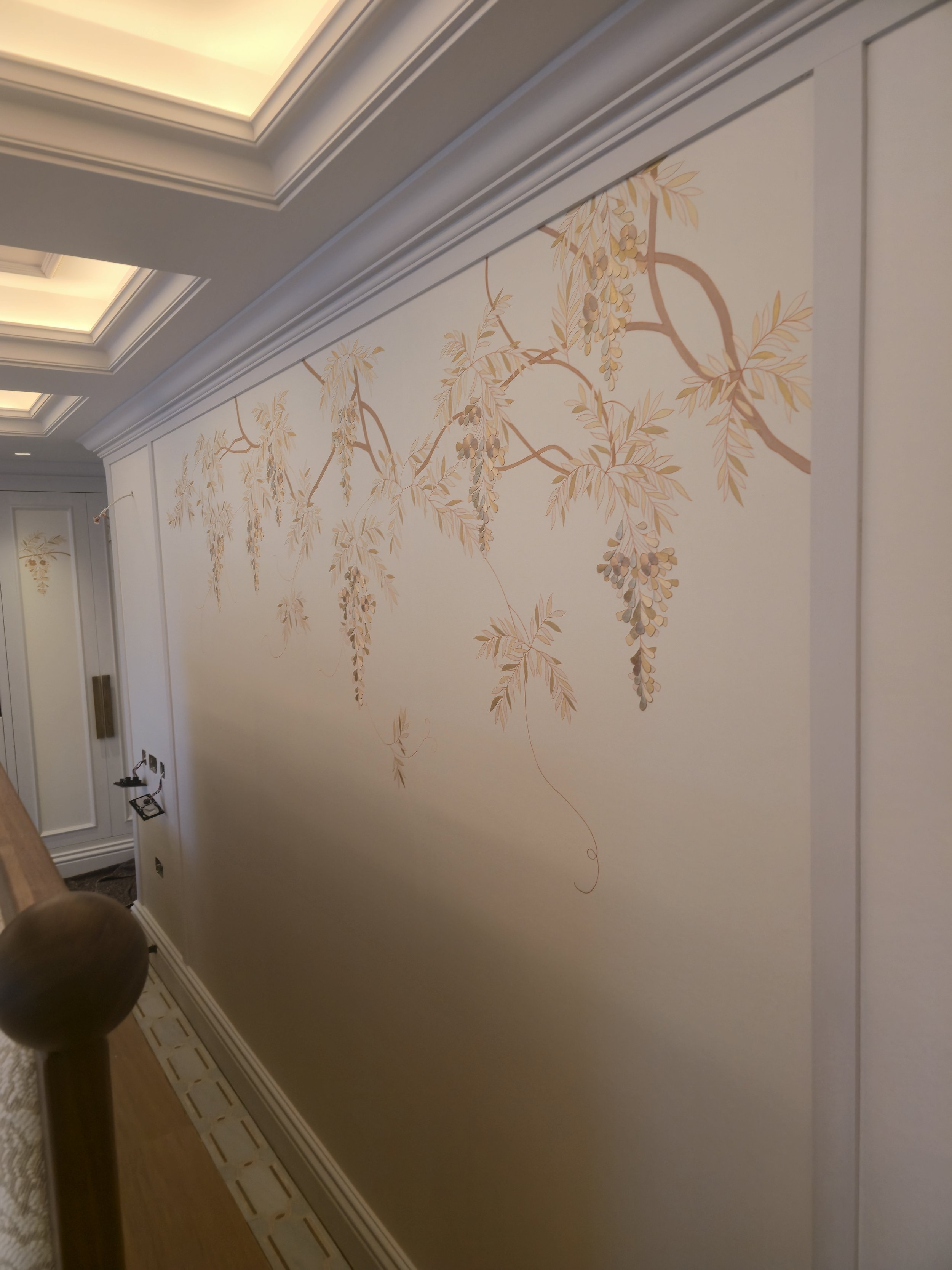 A flawless, seamless installation that highlights the artistry of hand-painted silk in a luxury interior.