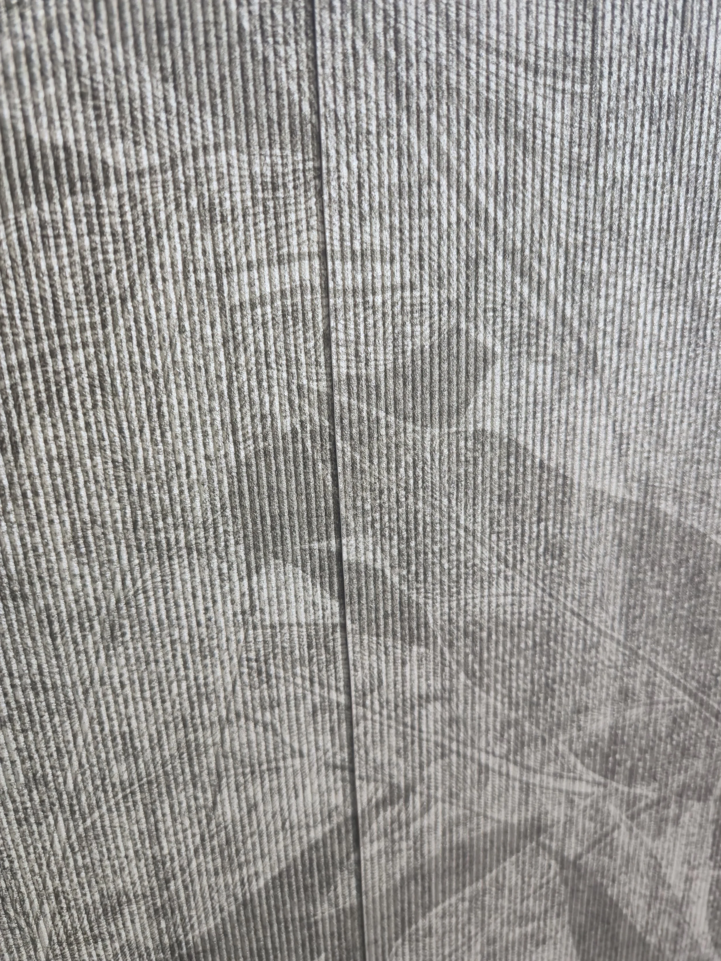 High-end Arte textured wallcovering with a seamless finish, expertly installed in a premium residential project.