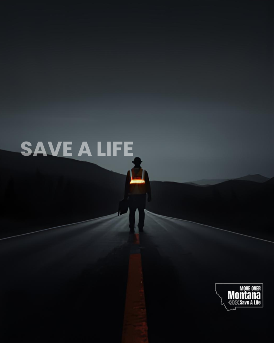 A person wearing a reflective vest and hat walking down an empty road at dusk or dawn with mountains in the background, accompanied by the text 'SAVE A LIFE' and a logo reading 'MOVE OVER Montana Save A Life'.