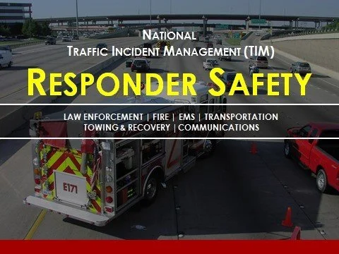 Traffic accident scene with emergency vehicles and responders on a multi-lane highway