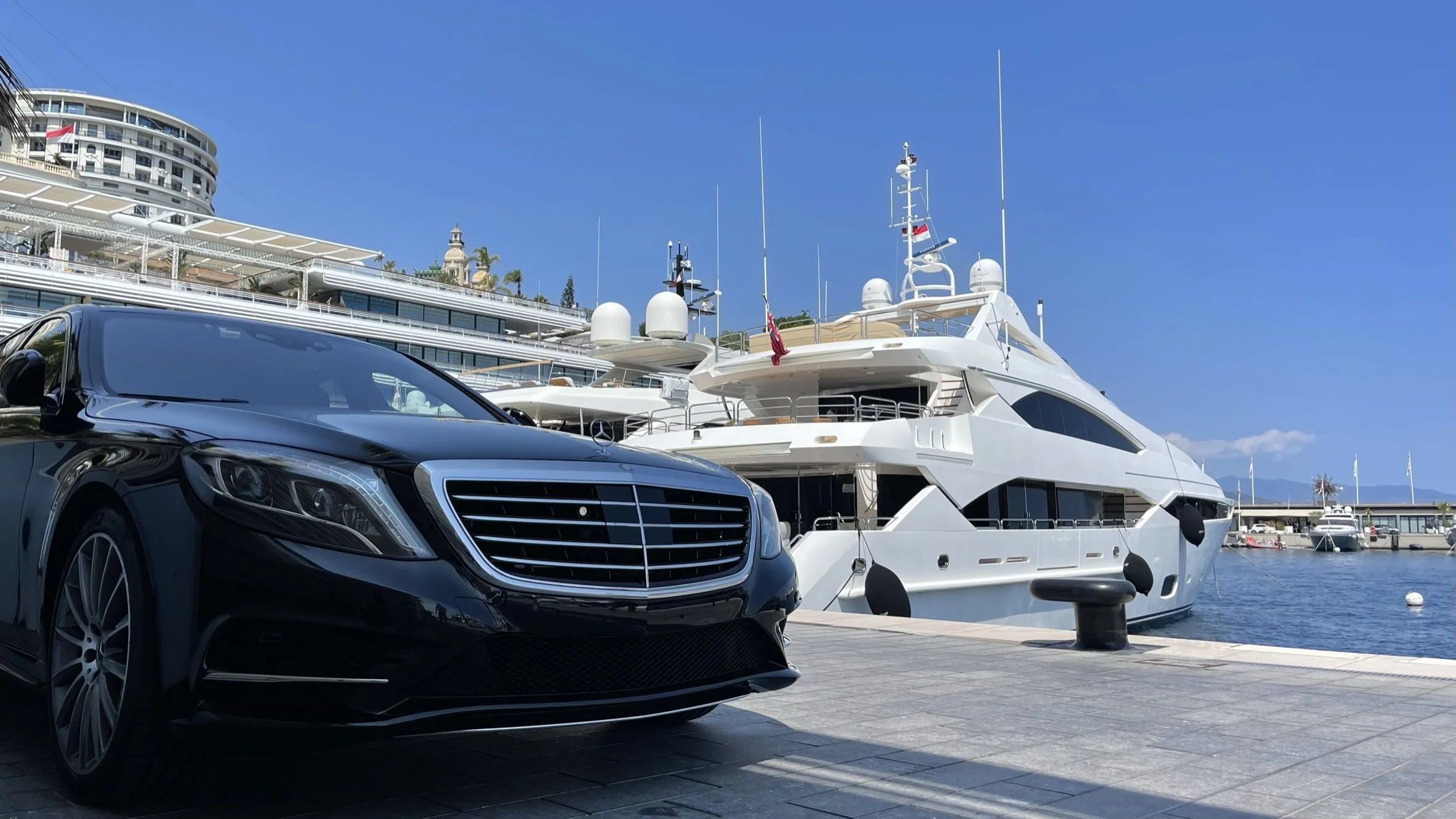 Mercedes-Benz S Class in Monaco harbour with yacht