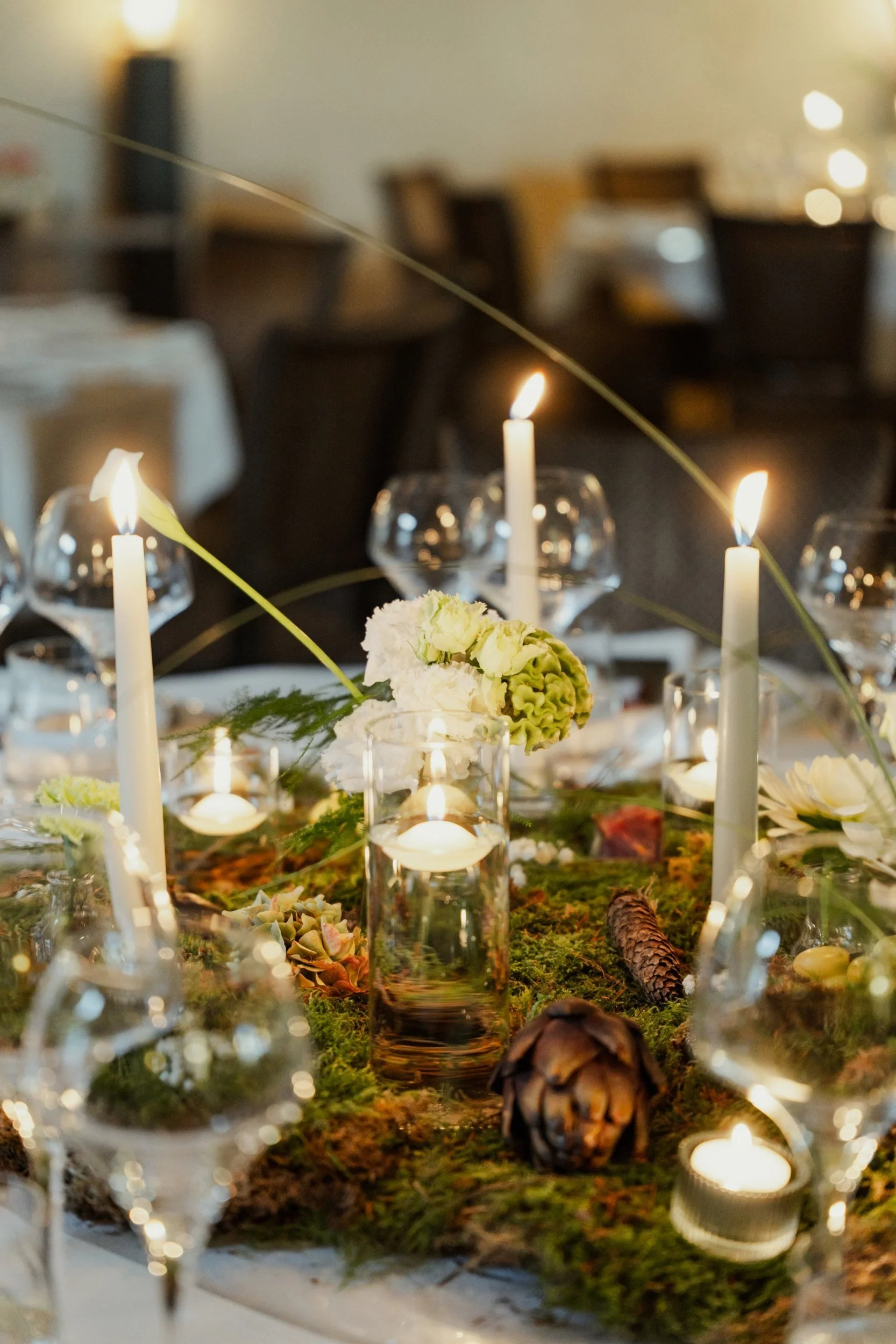 Candlelit moss centrepiece