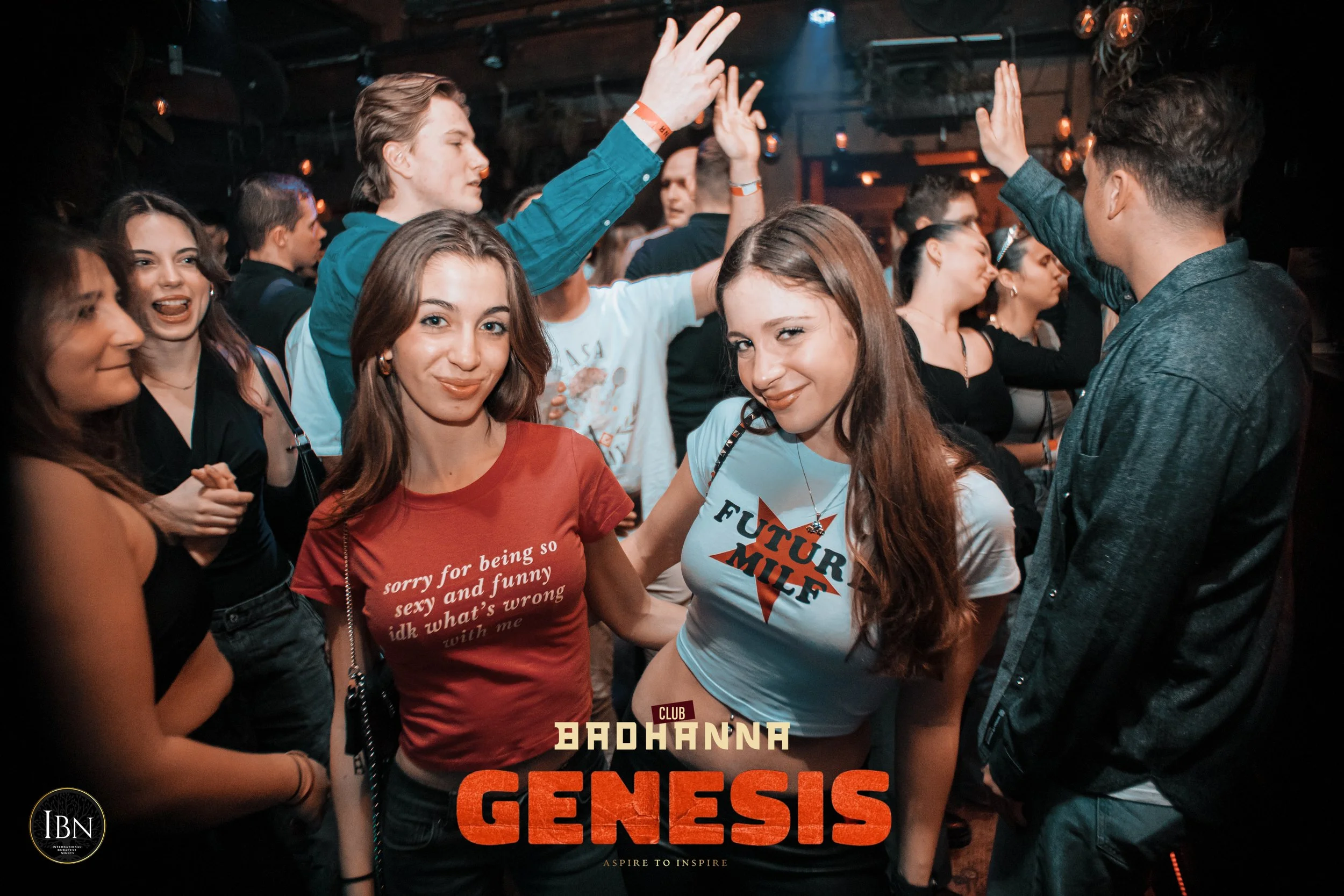 Group of young people at a club dancing and socializing with some smiling at the camera. The club is called "BODHANNNA GENESIS" as indicated at the bottom of the image.