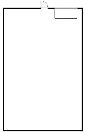 Floor plan of an empty warehouse space with a roll-up door at the top right corner and a man door in the top center.