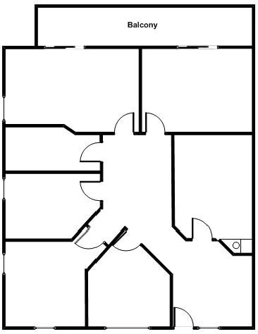 Floor plan of an apartment with a balcony at the top, multiple rooms including a living area at the bottom, and various doorways connecting the spaces.