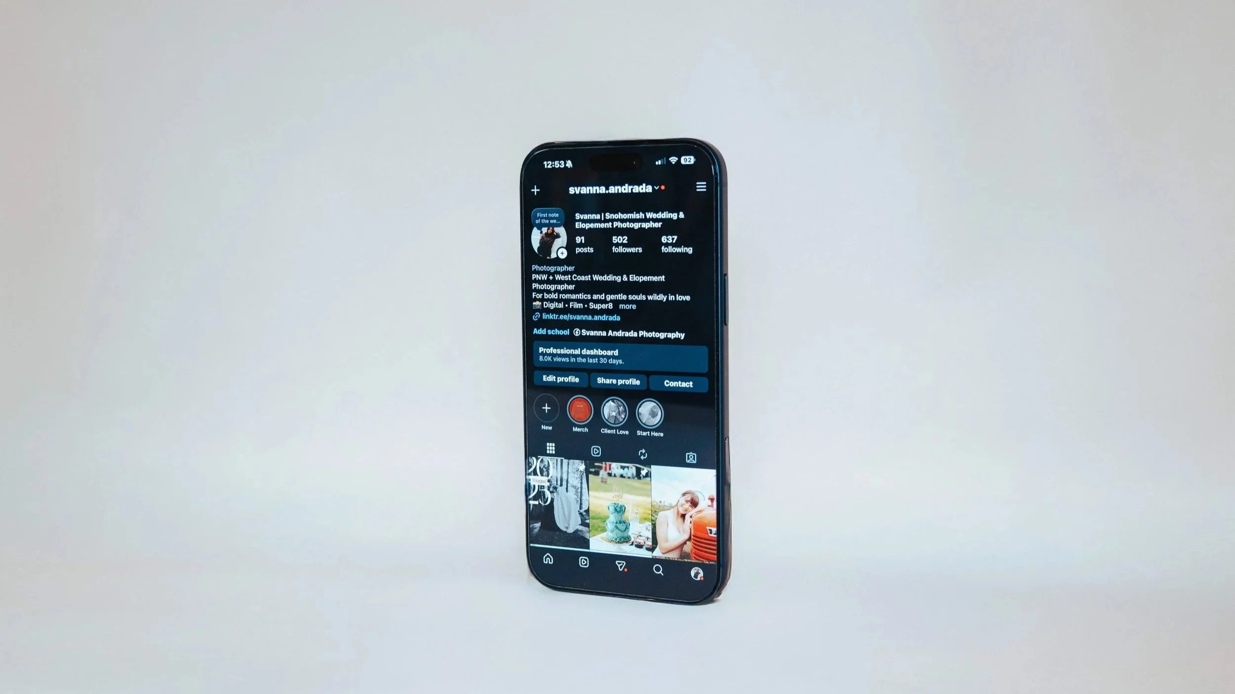 Mobile phone displaying Instagram profile and content strategy for small business social media marketing.