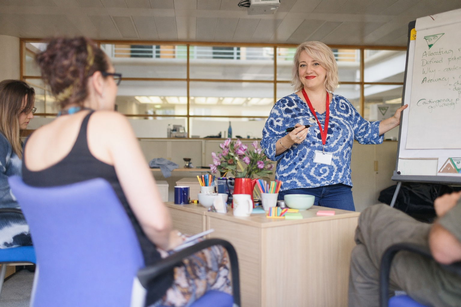 Jen providing training to a group of people
