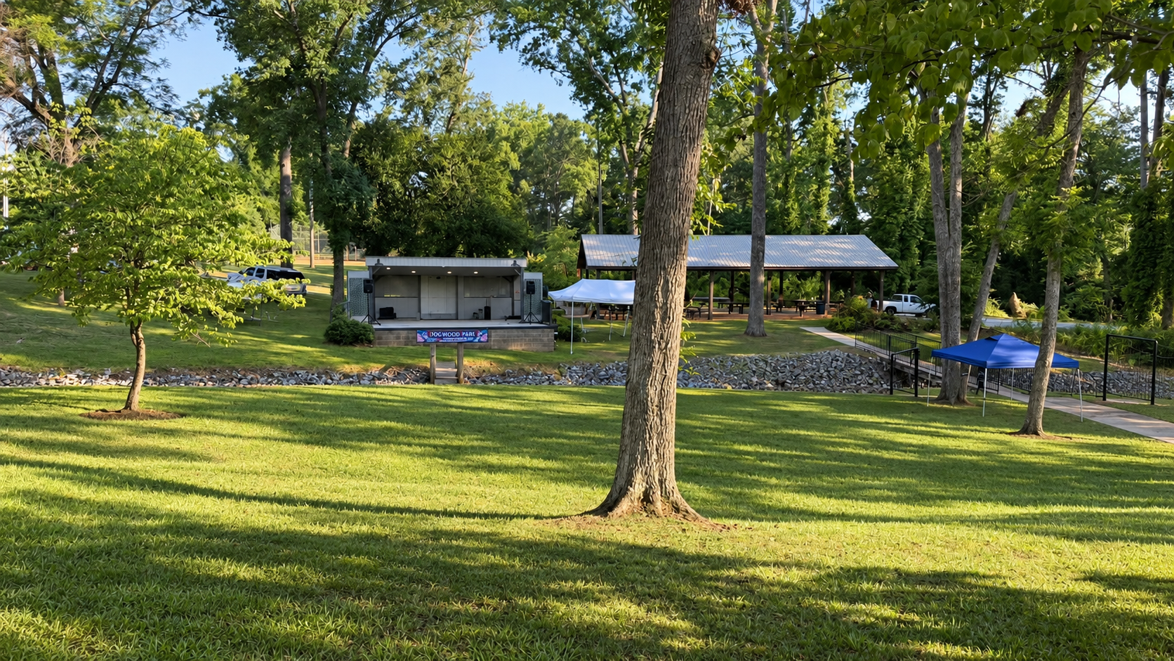 Dogwood Park in Honea Path, South Carolina, with an outdoor stage, pavilion, walking paths, and open green space