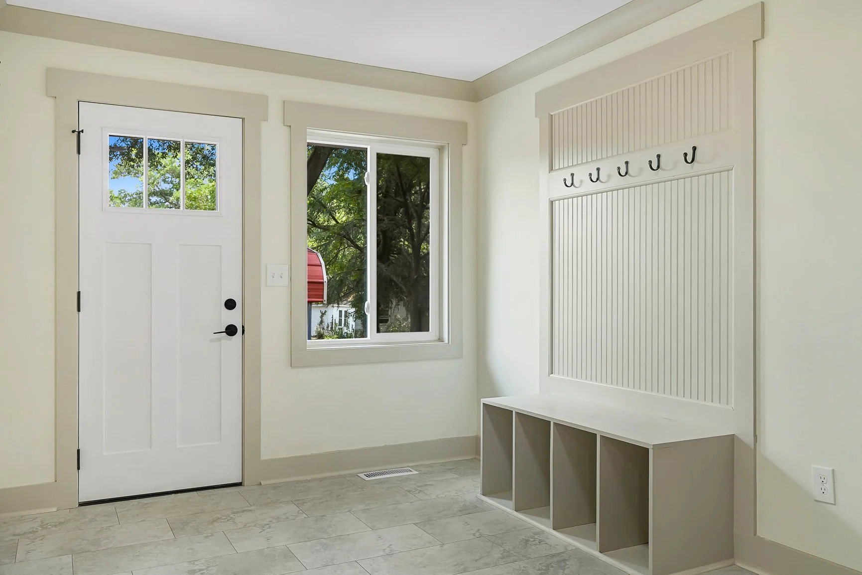 Side-entry mudroom at 227 Belton Dr with built-in storage and access to laundry and office space
