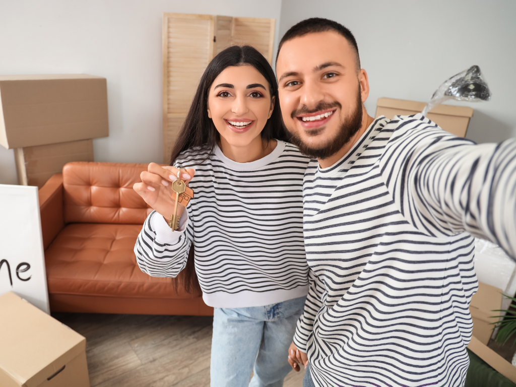 New homeowners receiving keys to their home after closing