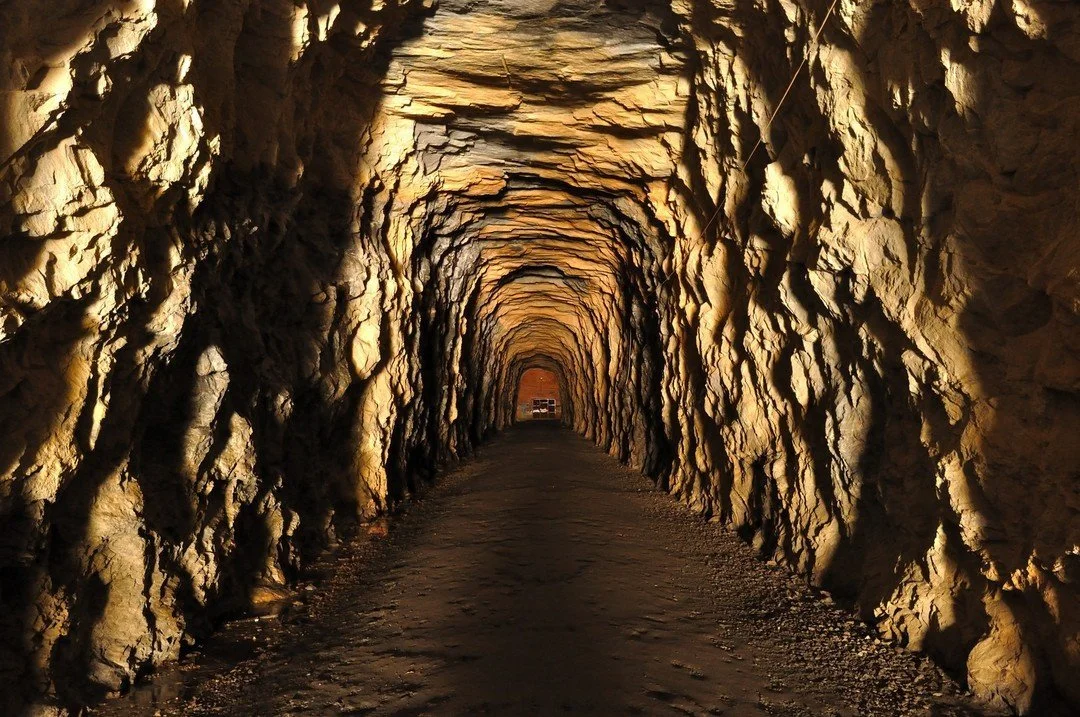 Interior view of Stumphouse Tunnel, a historic landmark in Oconee County, South Carolina