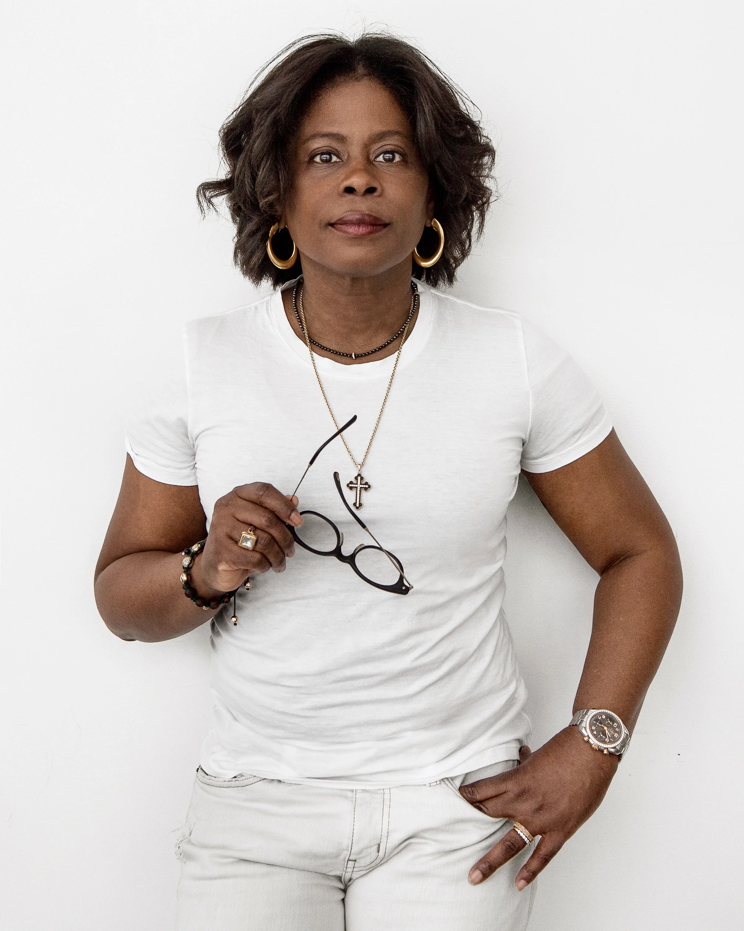 Meg Charles reflective portrait representing personal transformation and leadership evolution